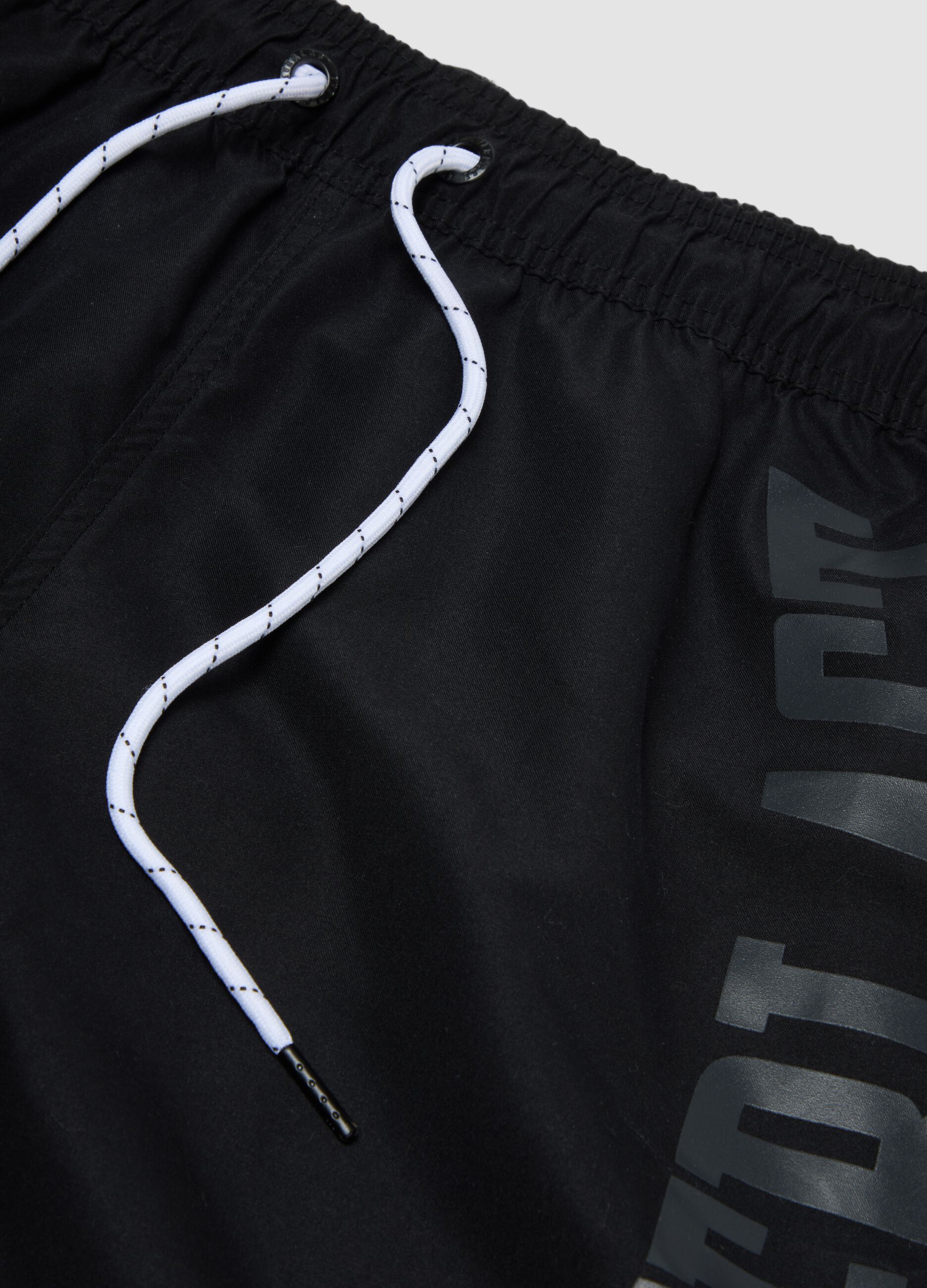 Black swim shorts with drawstring waist
