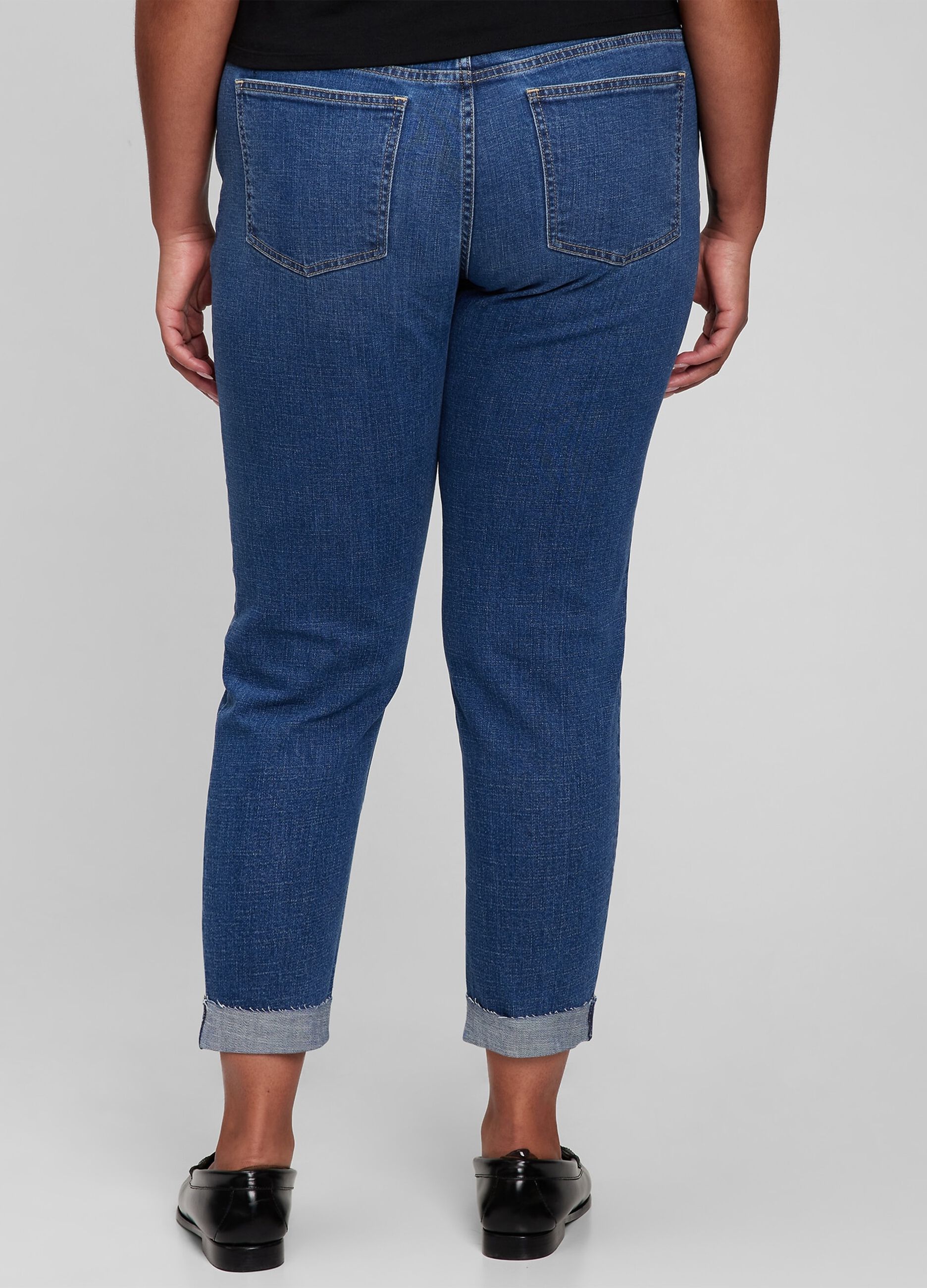 Girlfriend jeans with abrasions and raw edged hem