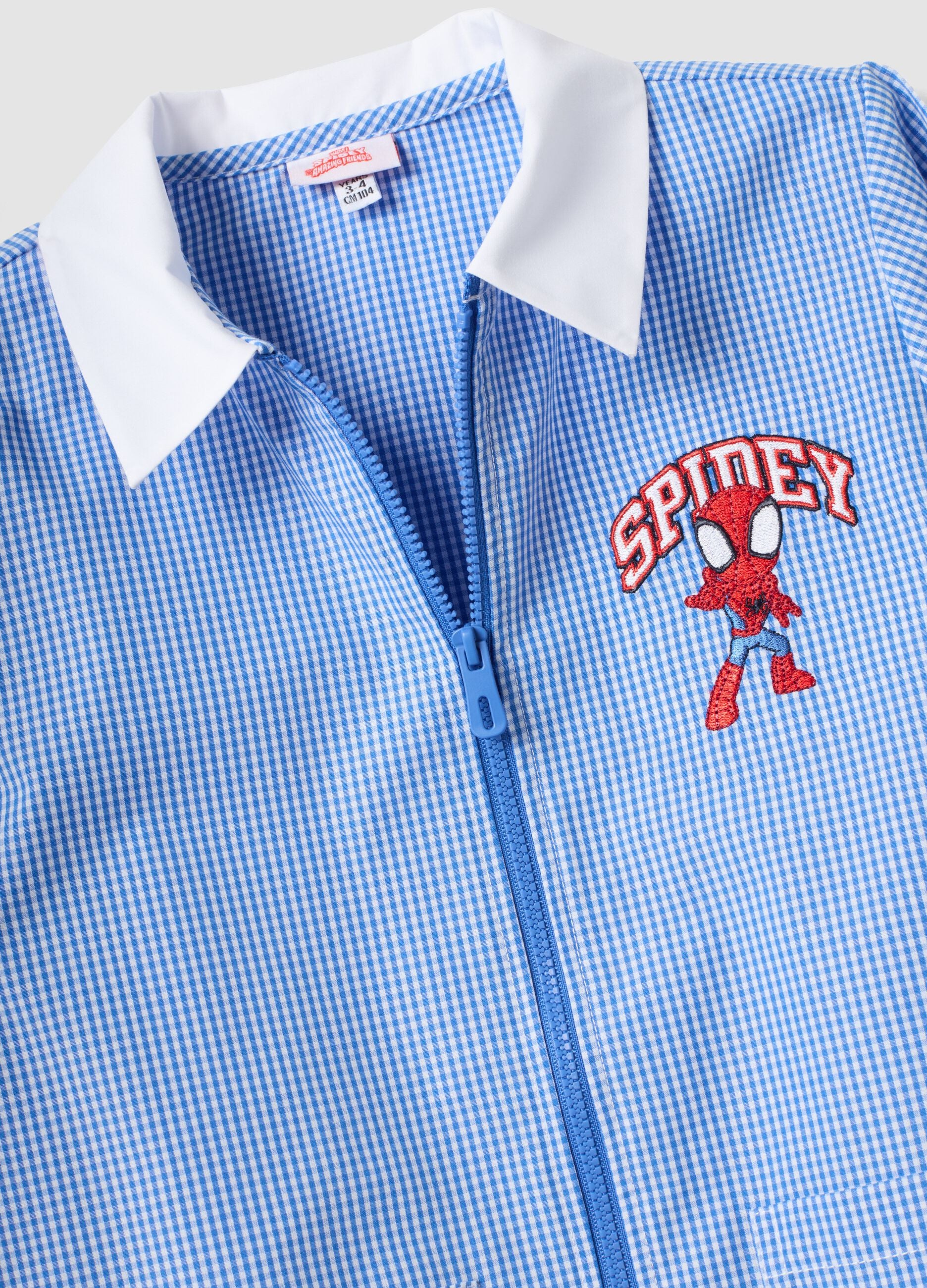 Blue gingham nursery apron with Spidey embroidery