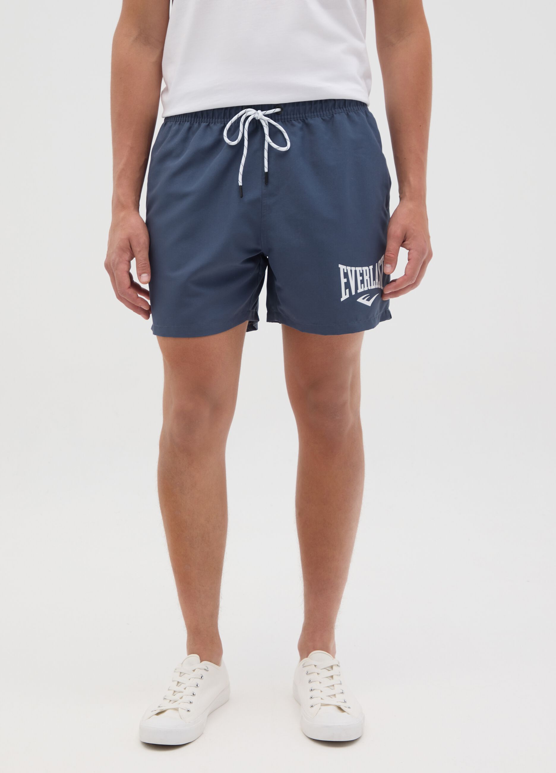 Blue swimming trunks with logo print