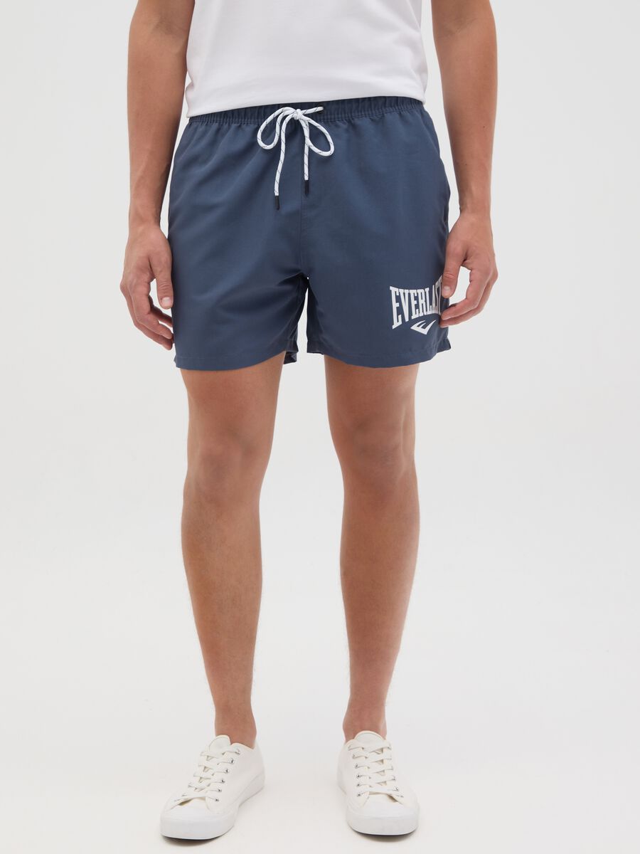 Blue swimming trunks with logo print_1