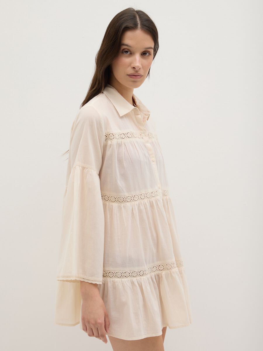 Short beach cover-up with embroidery in pure cotton_1