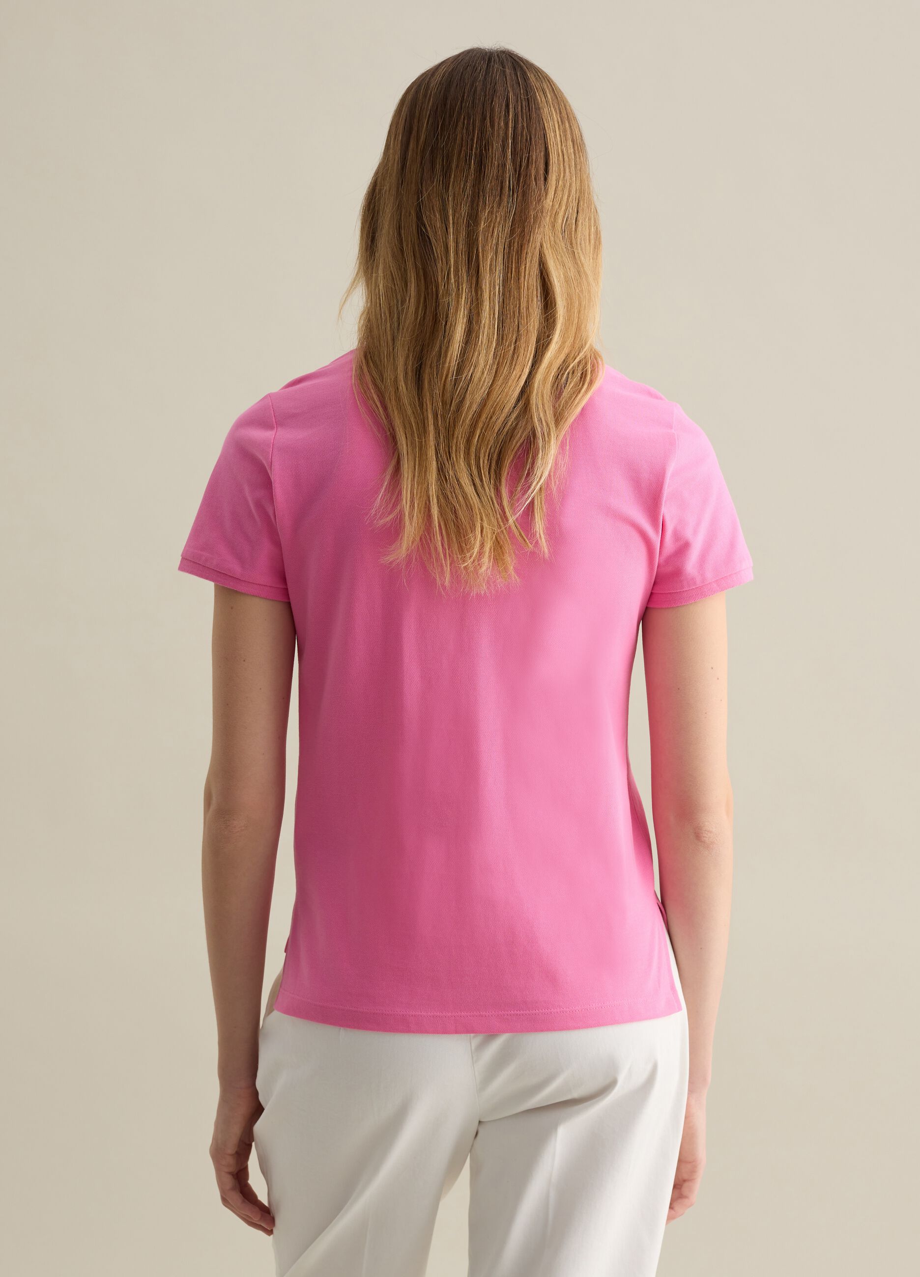 Pink short-sleeved polo shirt in piquet