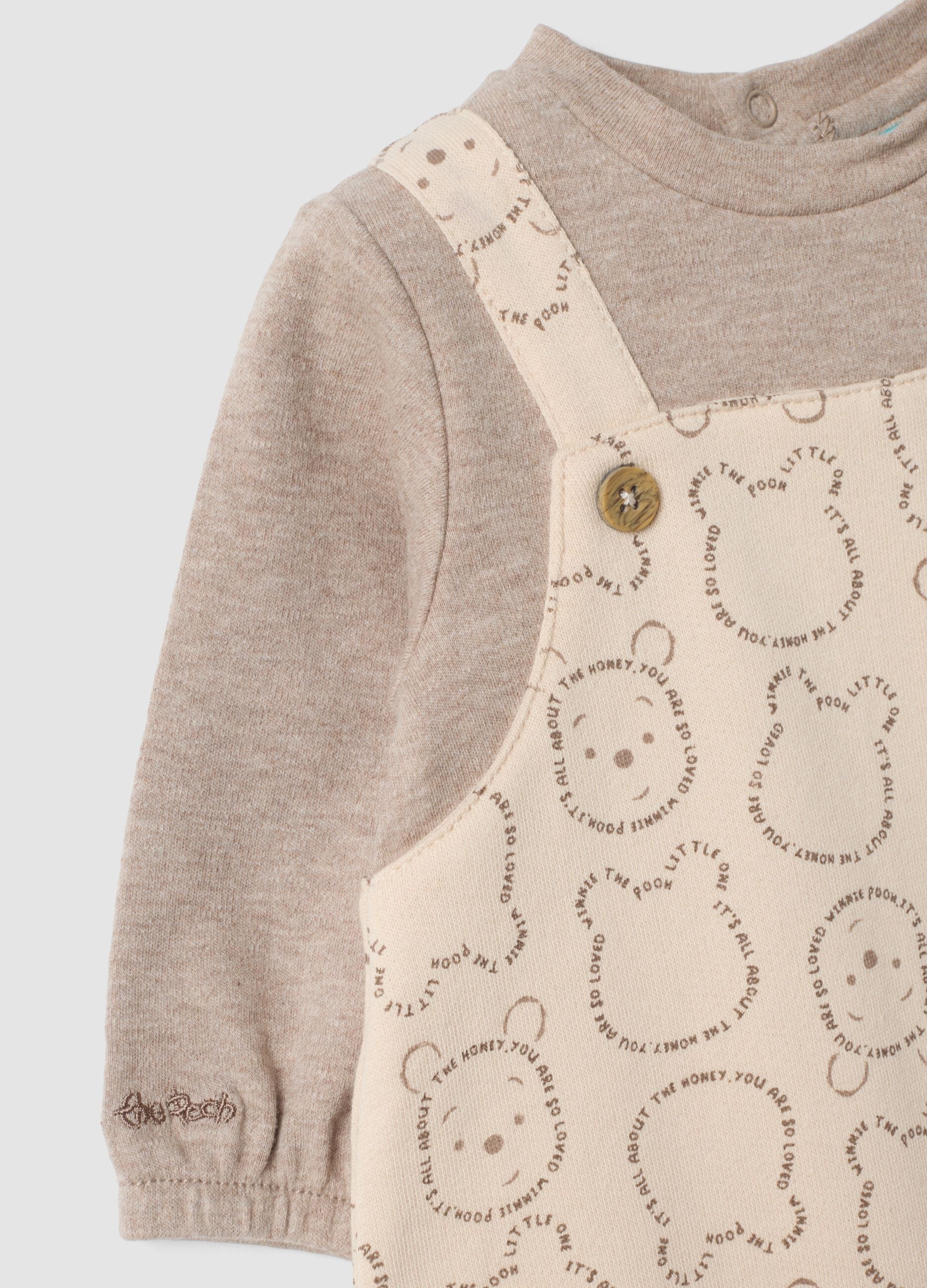 Grey organic cotton sleepsuit with Winnie the Pooh print