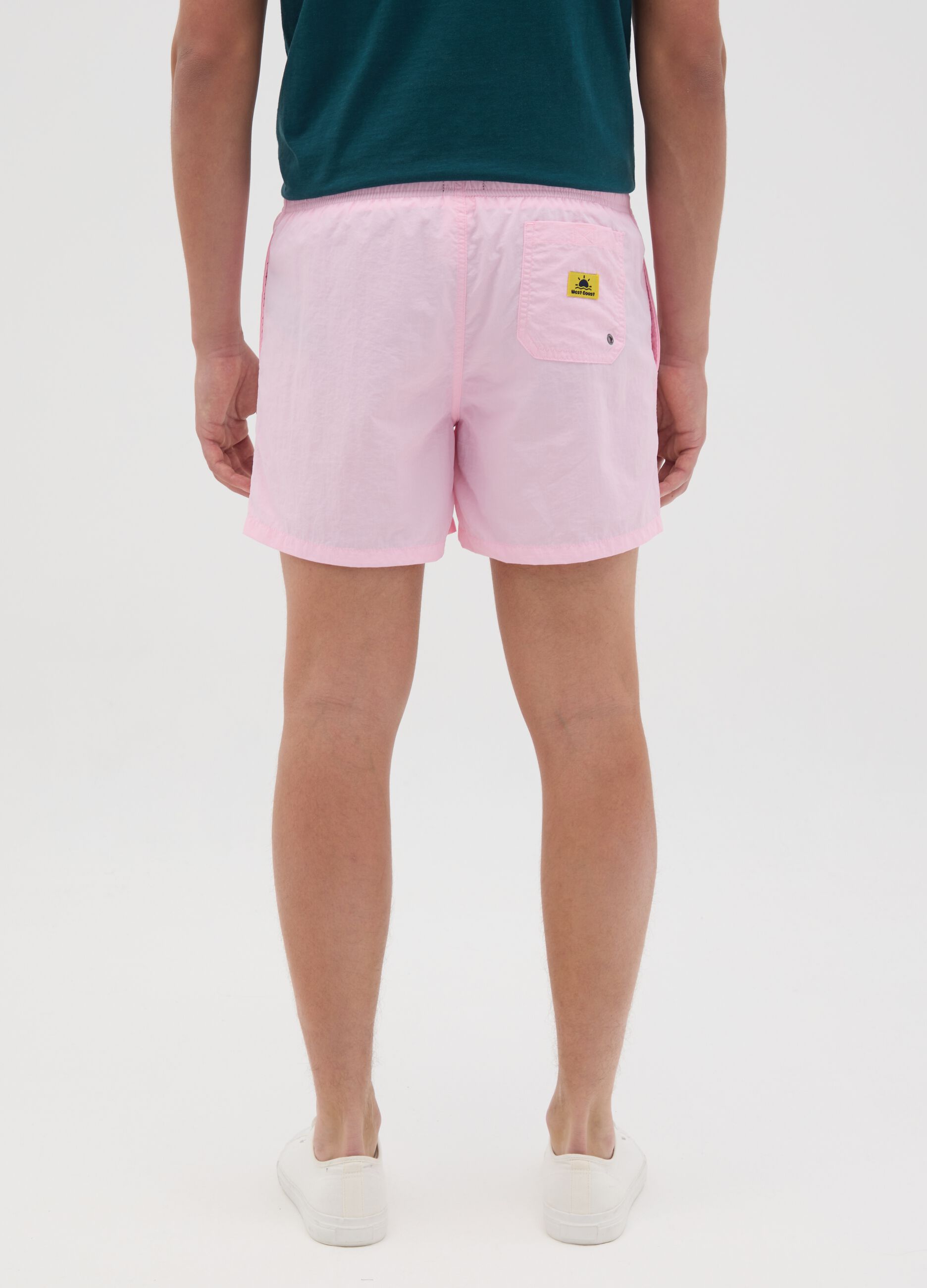 Pink swim trunks in mixed materials