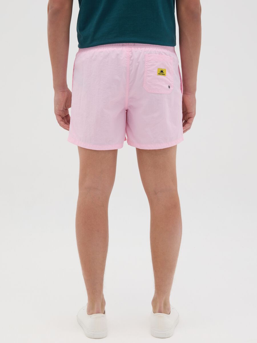 Pink swim trunks in mixed materials_3