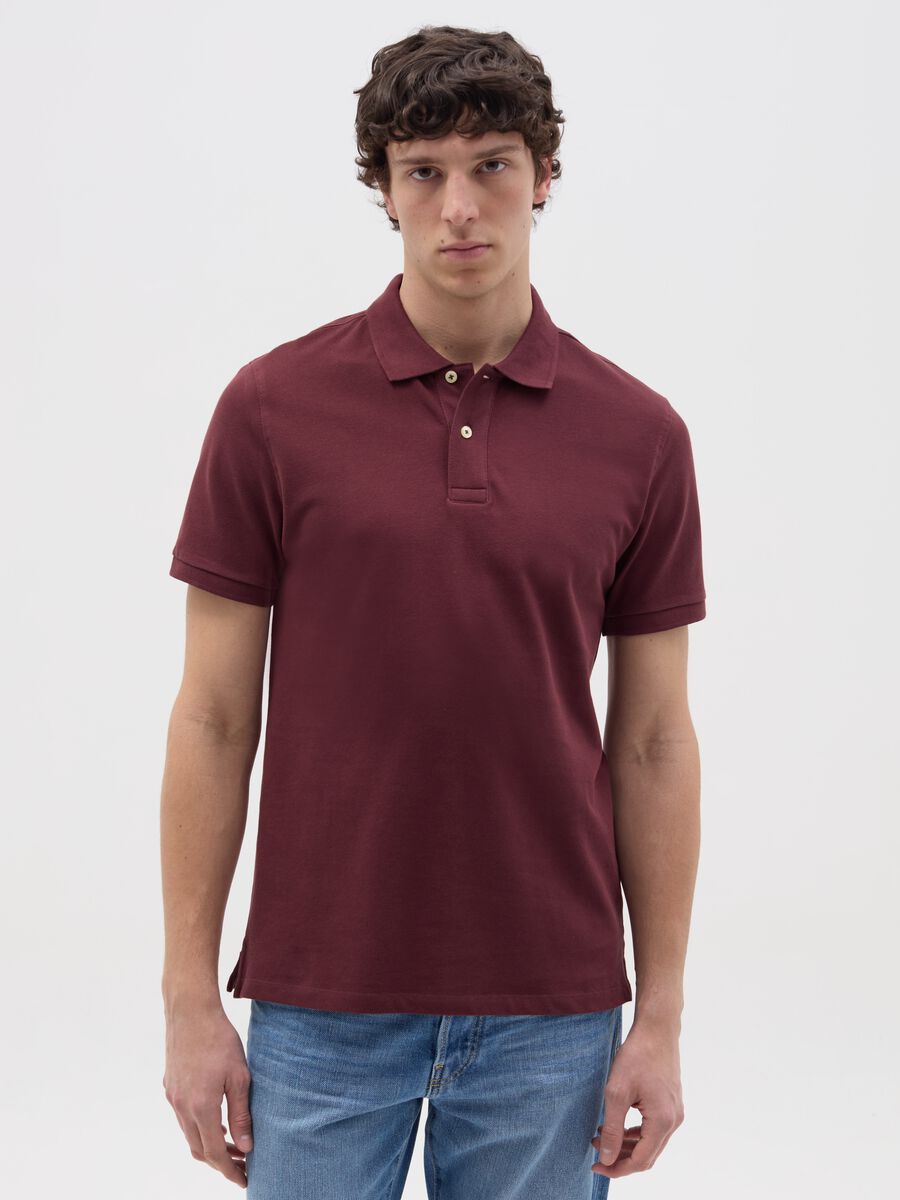 Solid colour polo shirt in organic cotton_0
