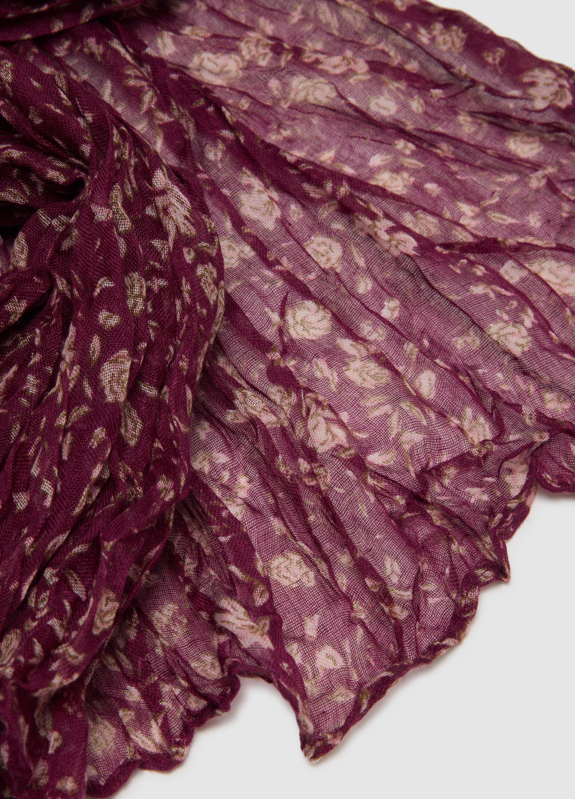 Purple fabric scarf with floral pattern