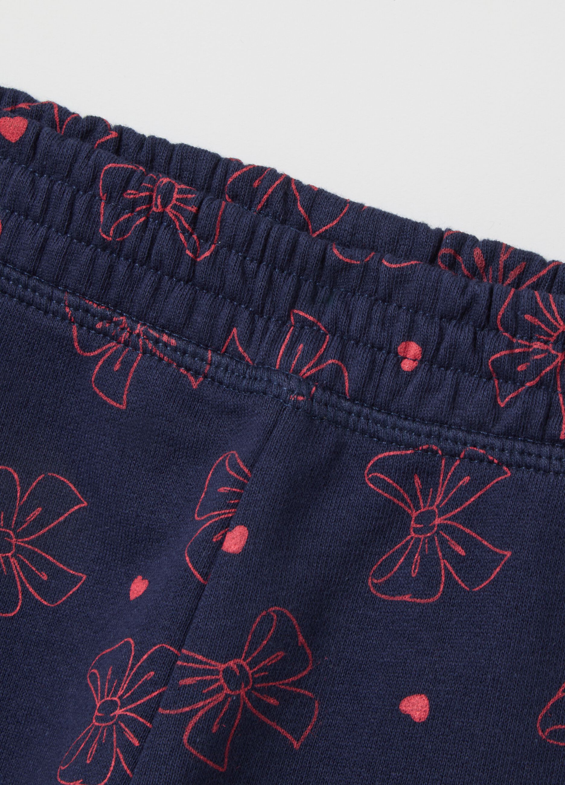 Blue leggings with bows and pink hearts