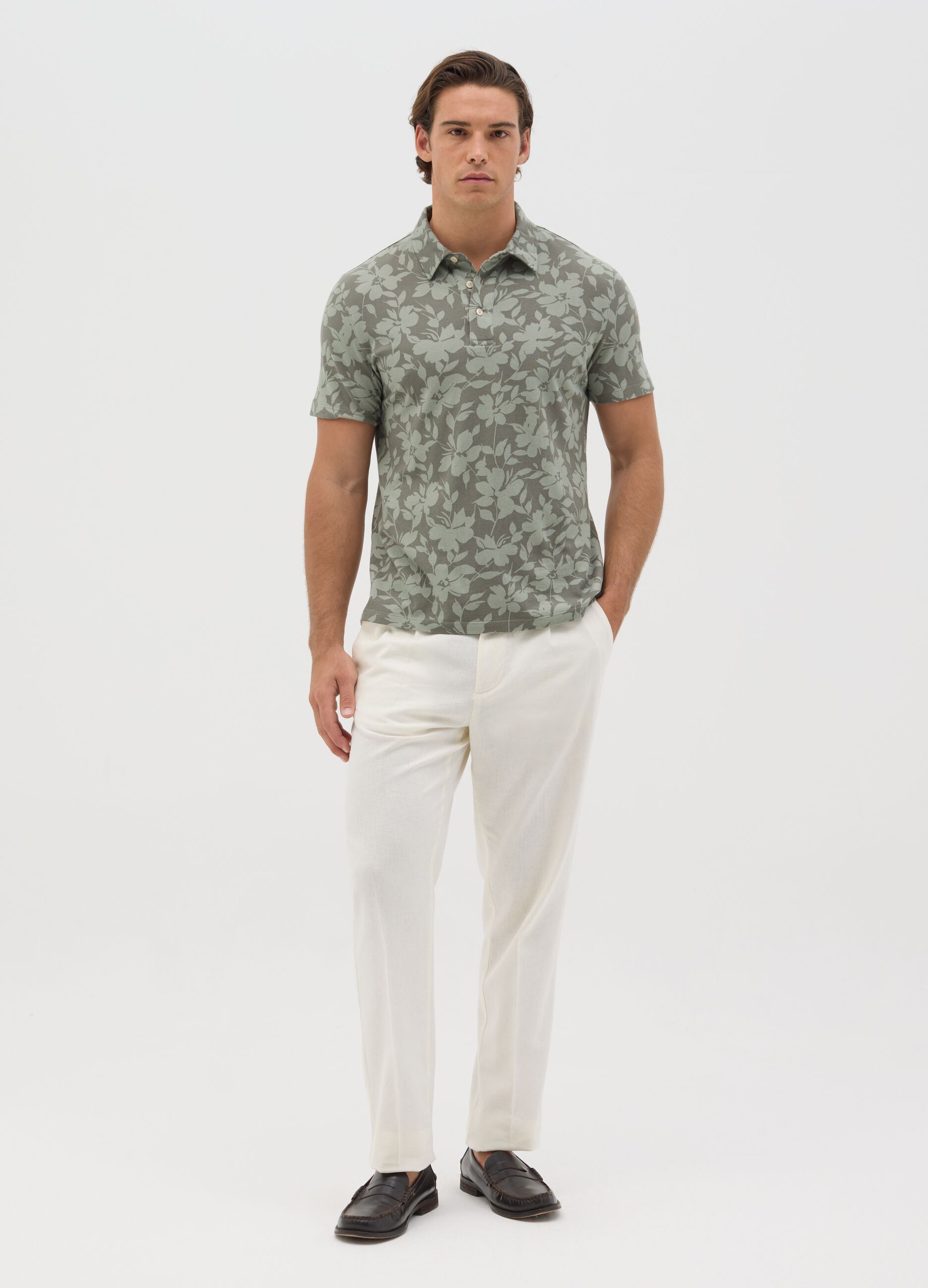 BST green polo shirt with short sleeves and floral print
