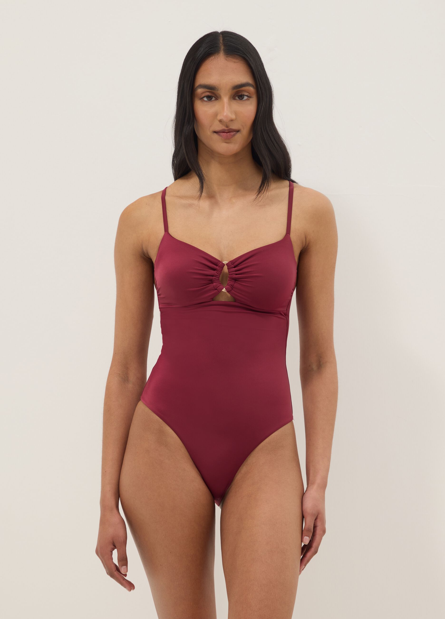 Red stretchy one-piece swimsuit with straps
