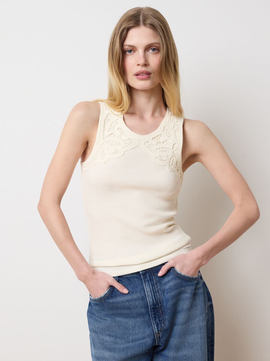 Ivory sleeveless top with embroidered details_0