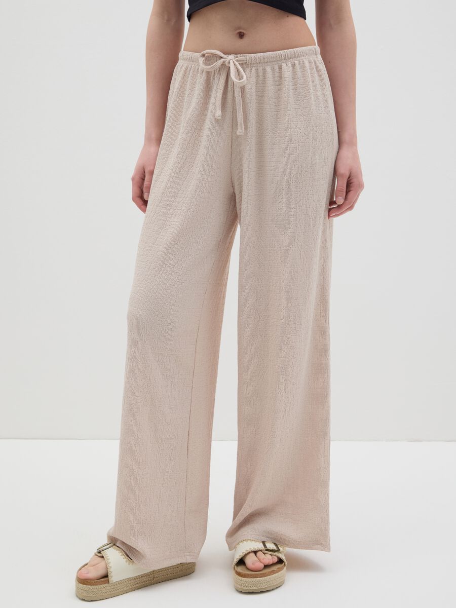 Women's beige regular-fit palazzo pants in stretch fabric._1