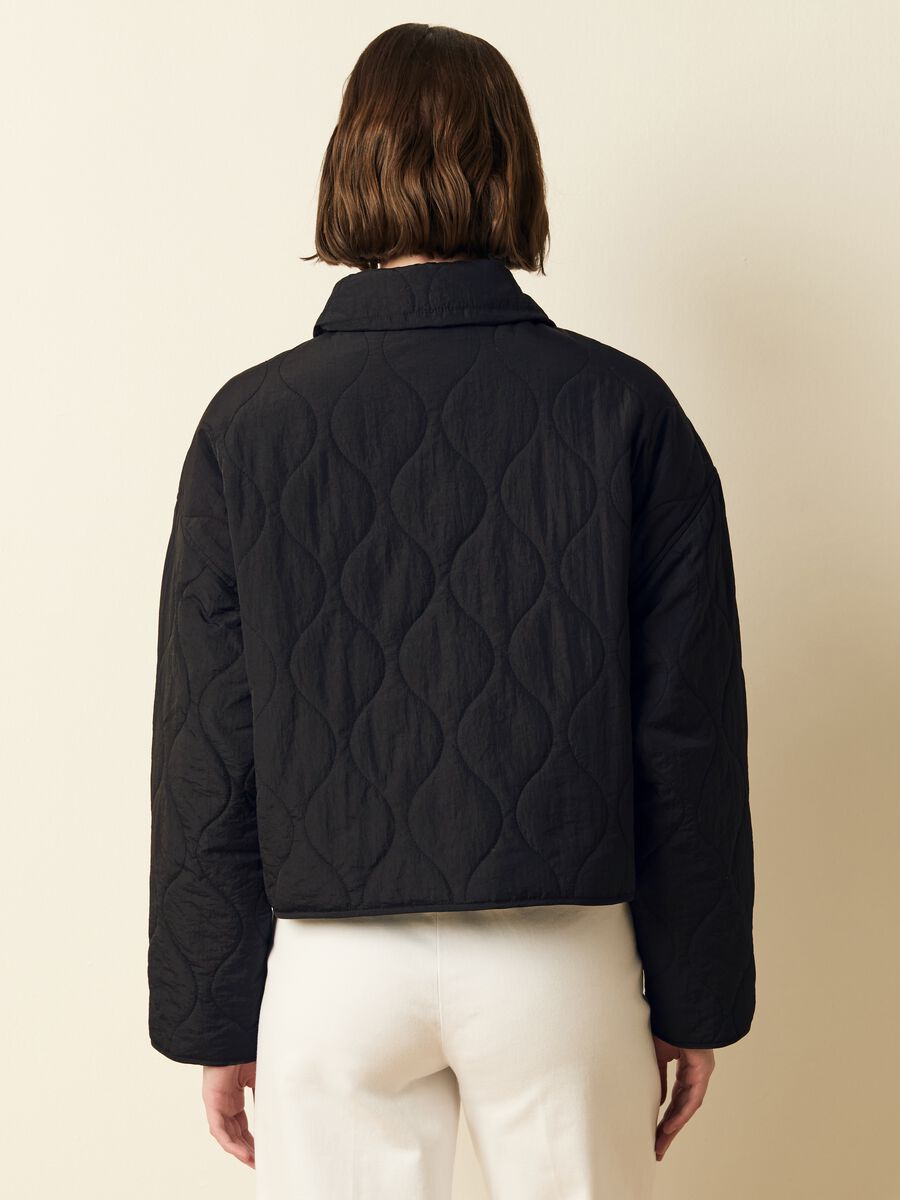 Short quilted jacket with buttons_3