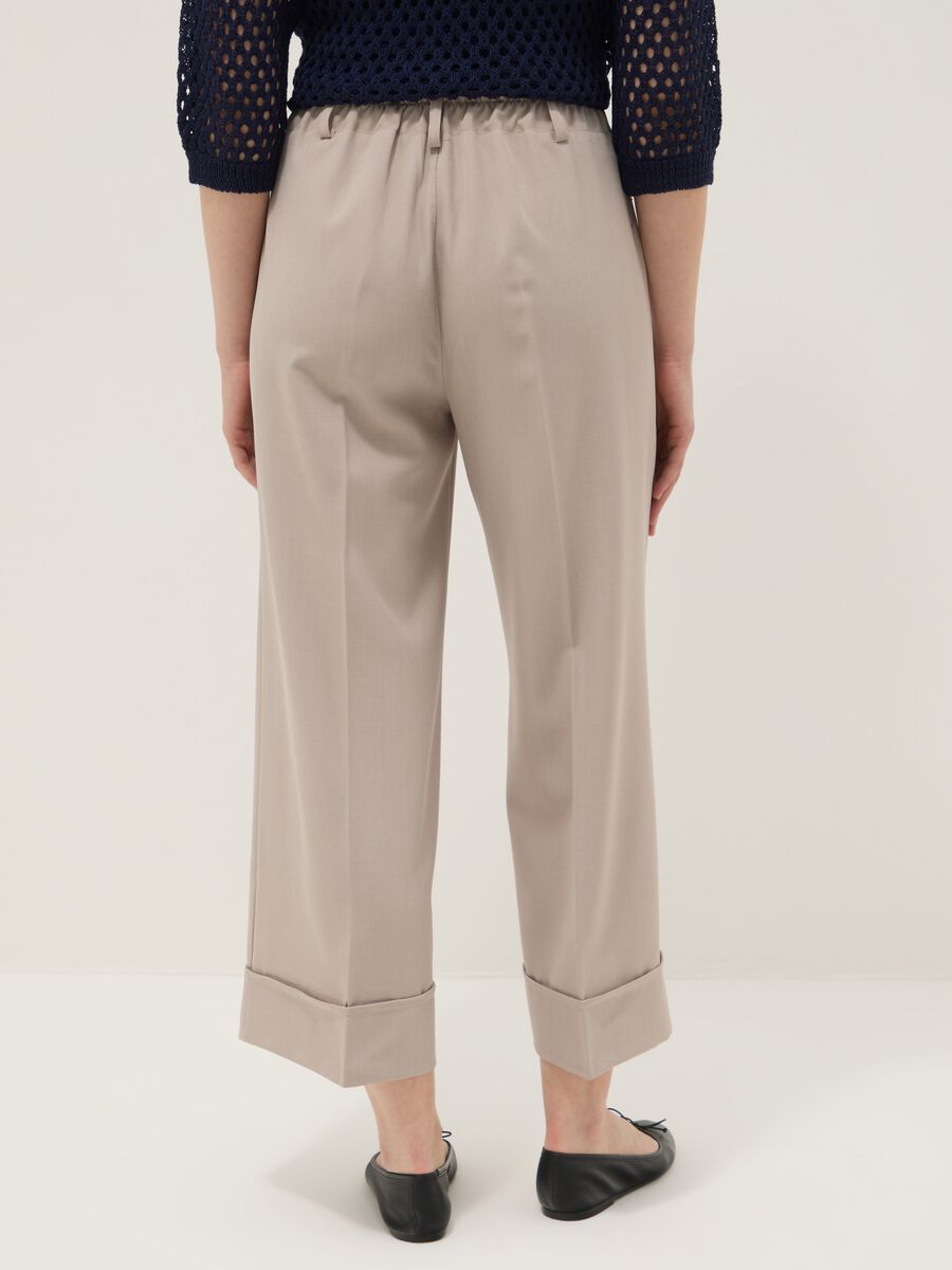 Beige stretch trousers with turn-up hem_2
