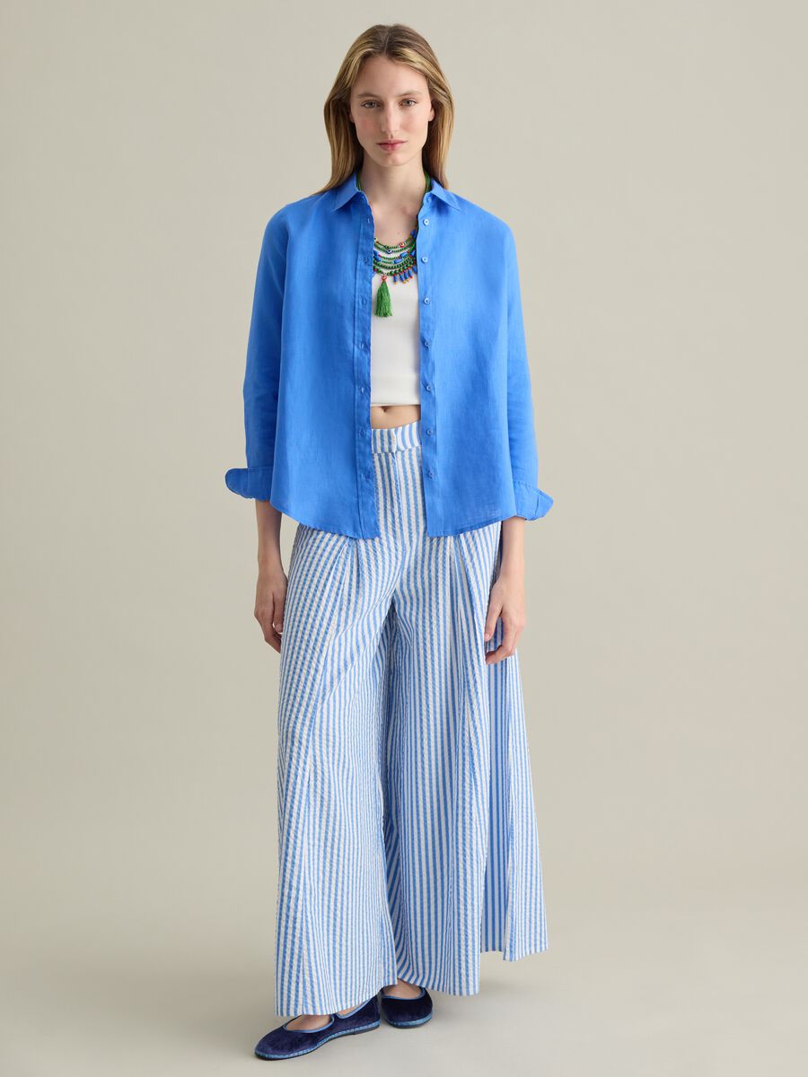 Blue flare-fit trousers in striped seersucker_0