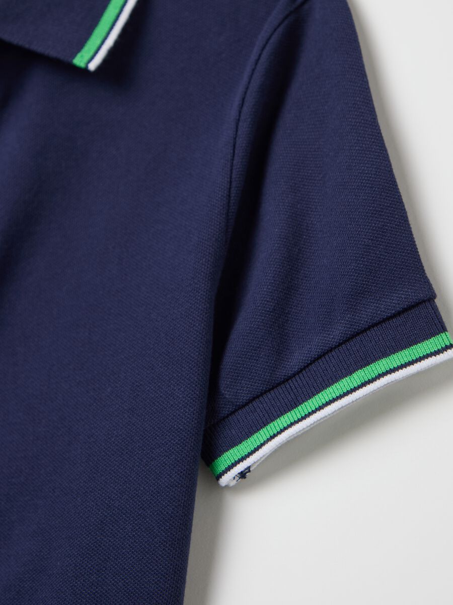 Blue cotton polo shirt with striped edging_3