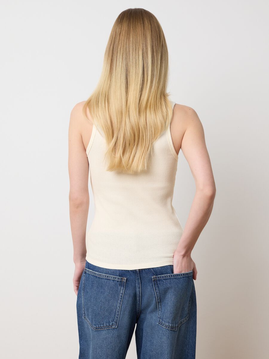 Ivory sleeveless top with embroidered details_2