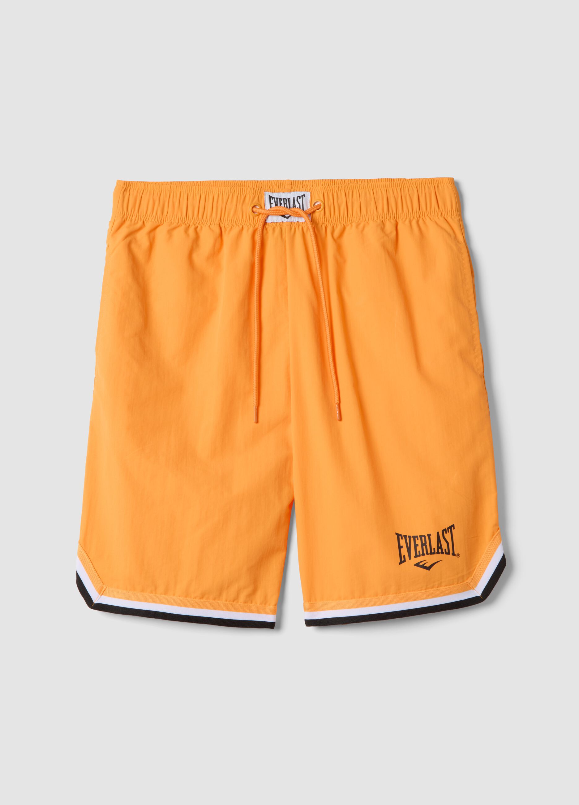 Orange regular fit sports shorts with white and black details