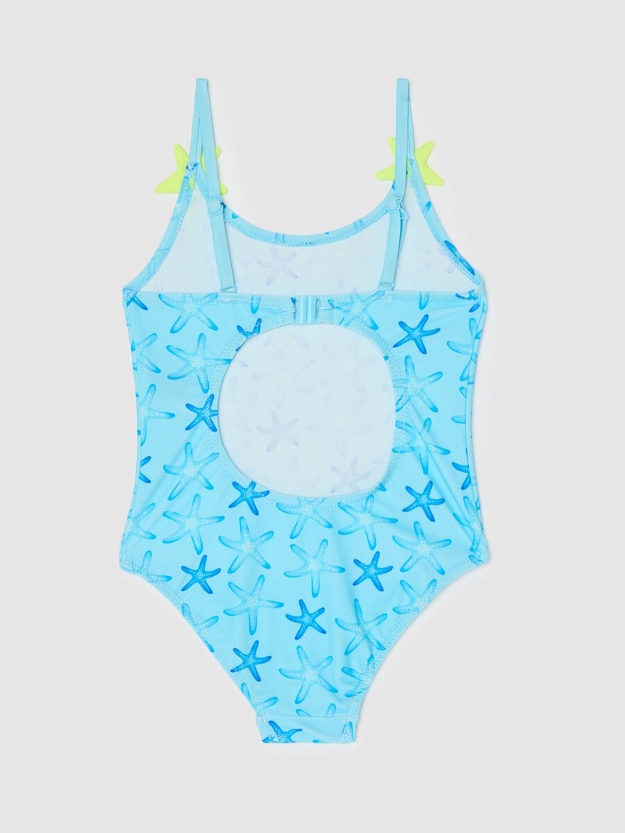 Girls’ one-piece swimsuit in light blue stretch fabric with starfish design_1