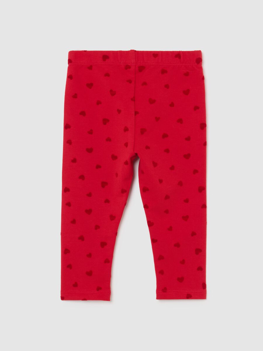 Red leggings for girls in stretch cotton with heart prints_1