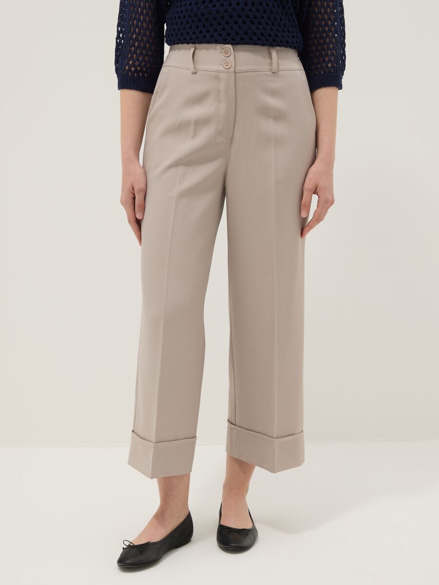 Beige stretch trousers with turn-up hem_1