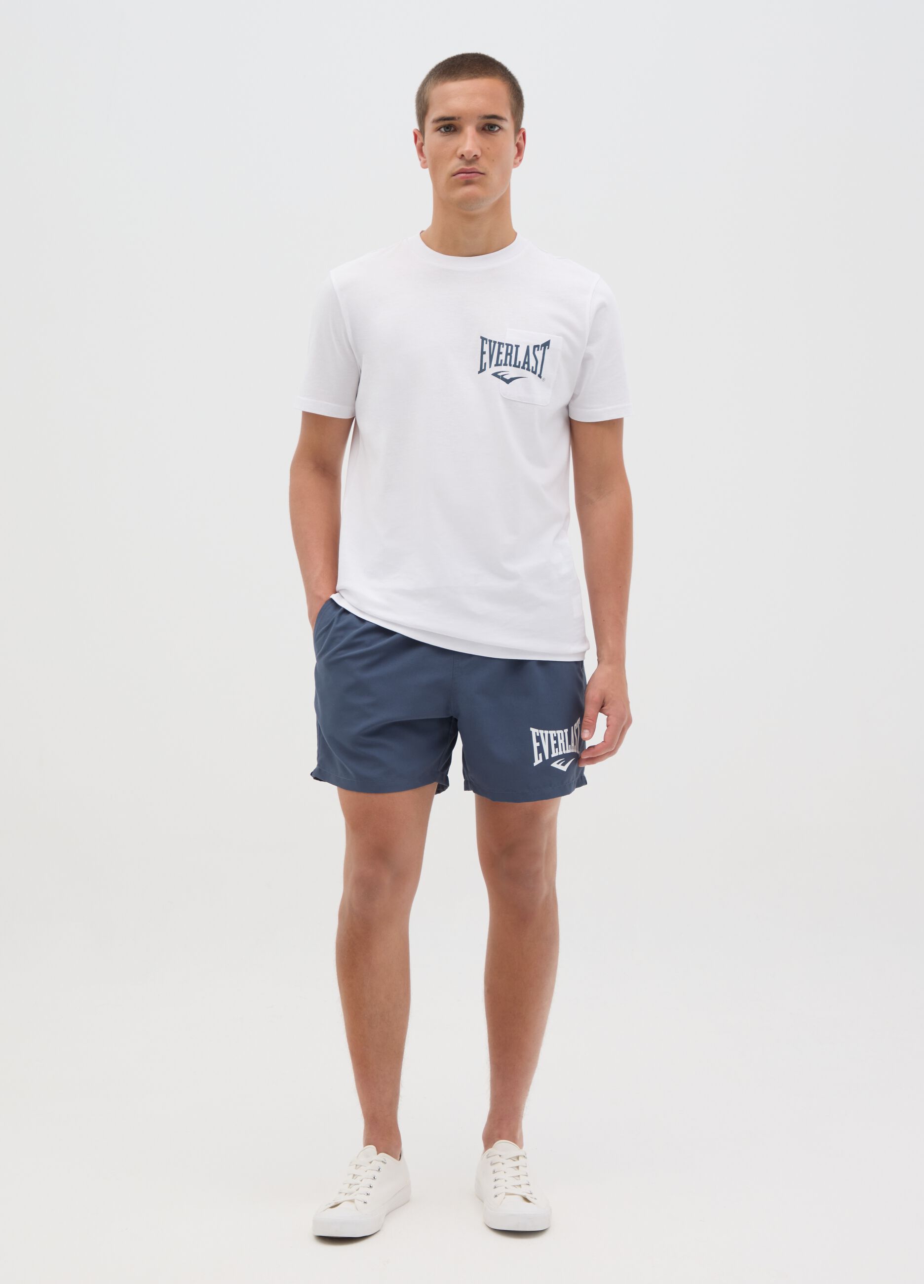 Blue swimming trunks with logo print