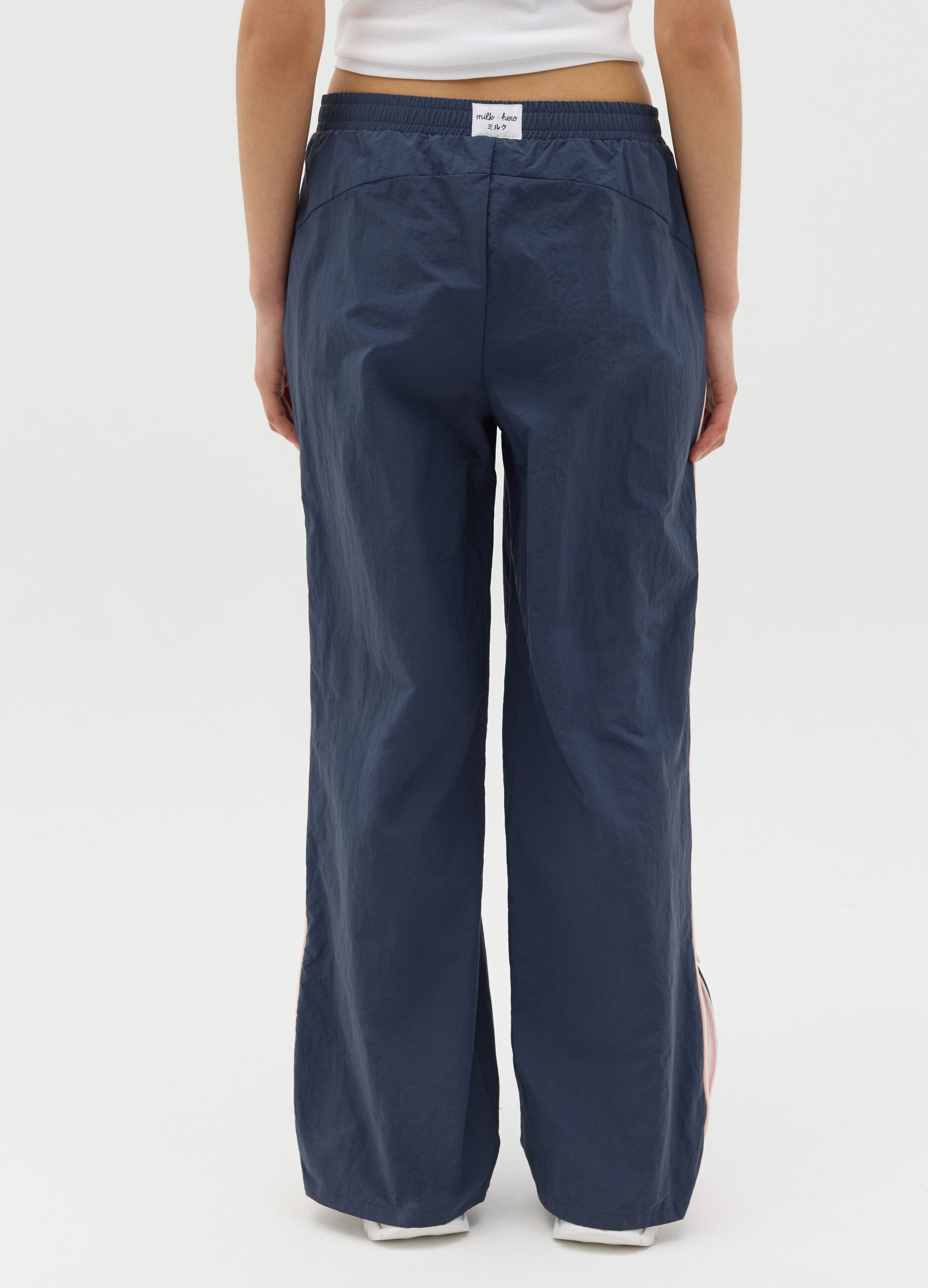 Navy blue nylon joggers with splits and zip