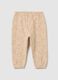 Girls' beige cotton joggers with print_1