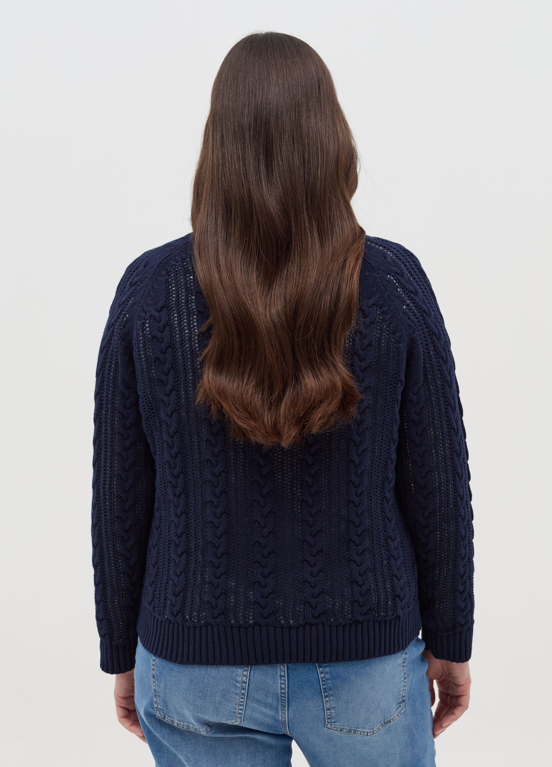 Curvy crochet pullover with cable-knit design