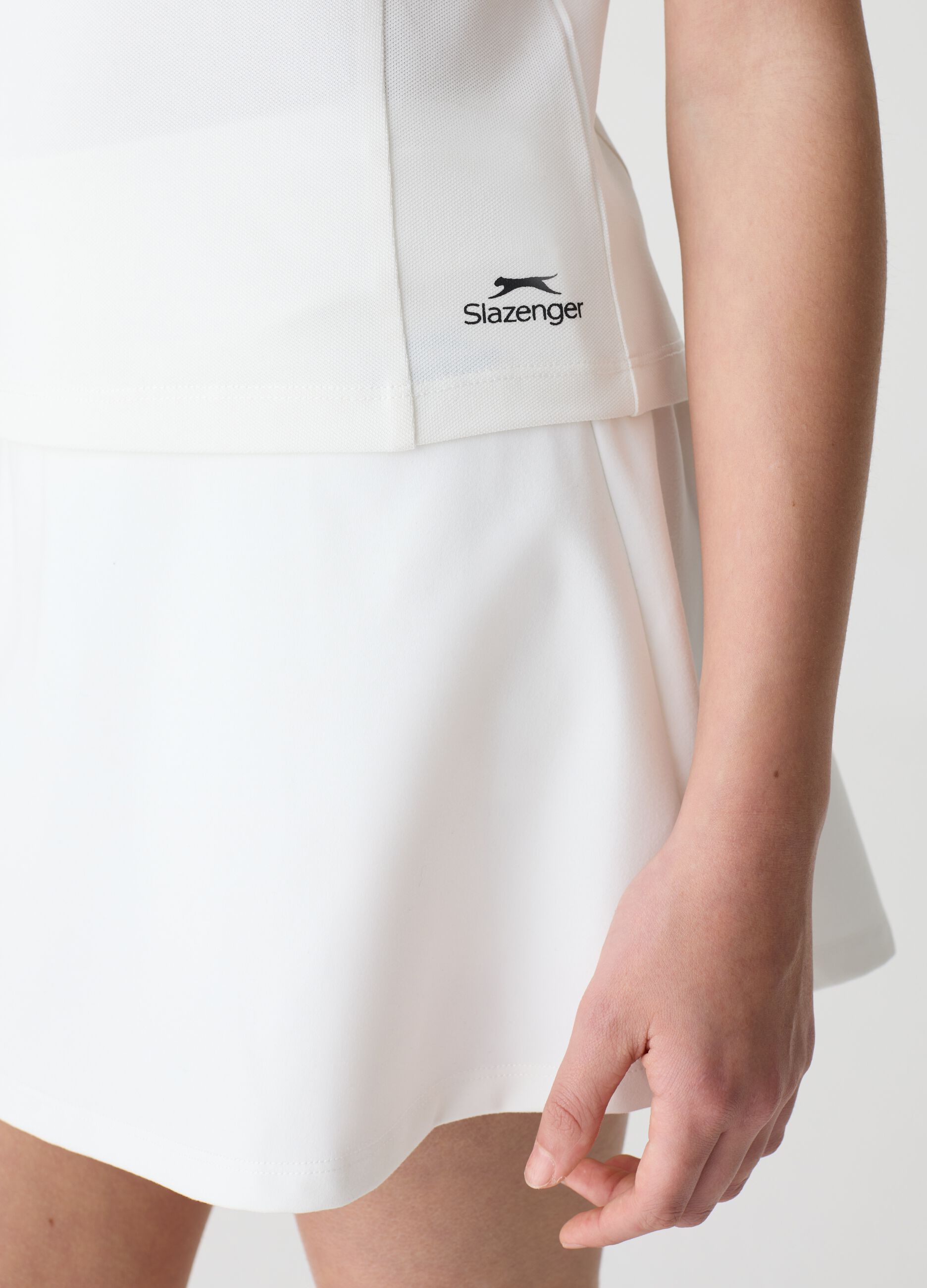 Polo smanicata in tessuto tecnico SLAZENGER