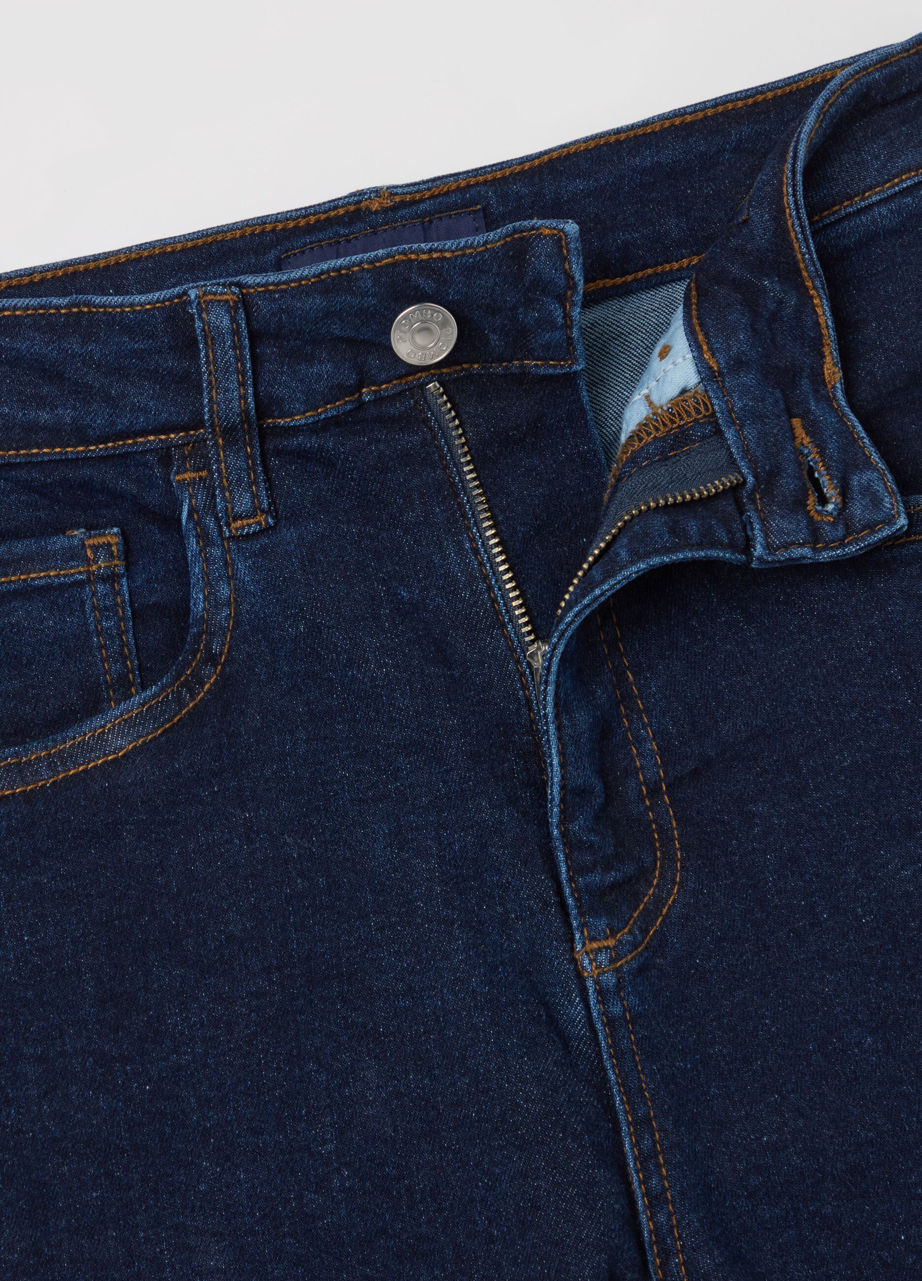 Cropped blue flare-fit jeans with raw edging