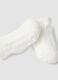 Scarpine bianche in misto cotone organico con fiocchetto per neonata_1