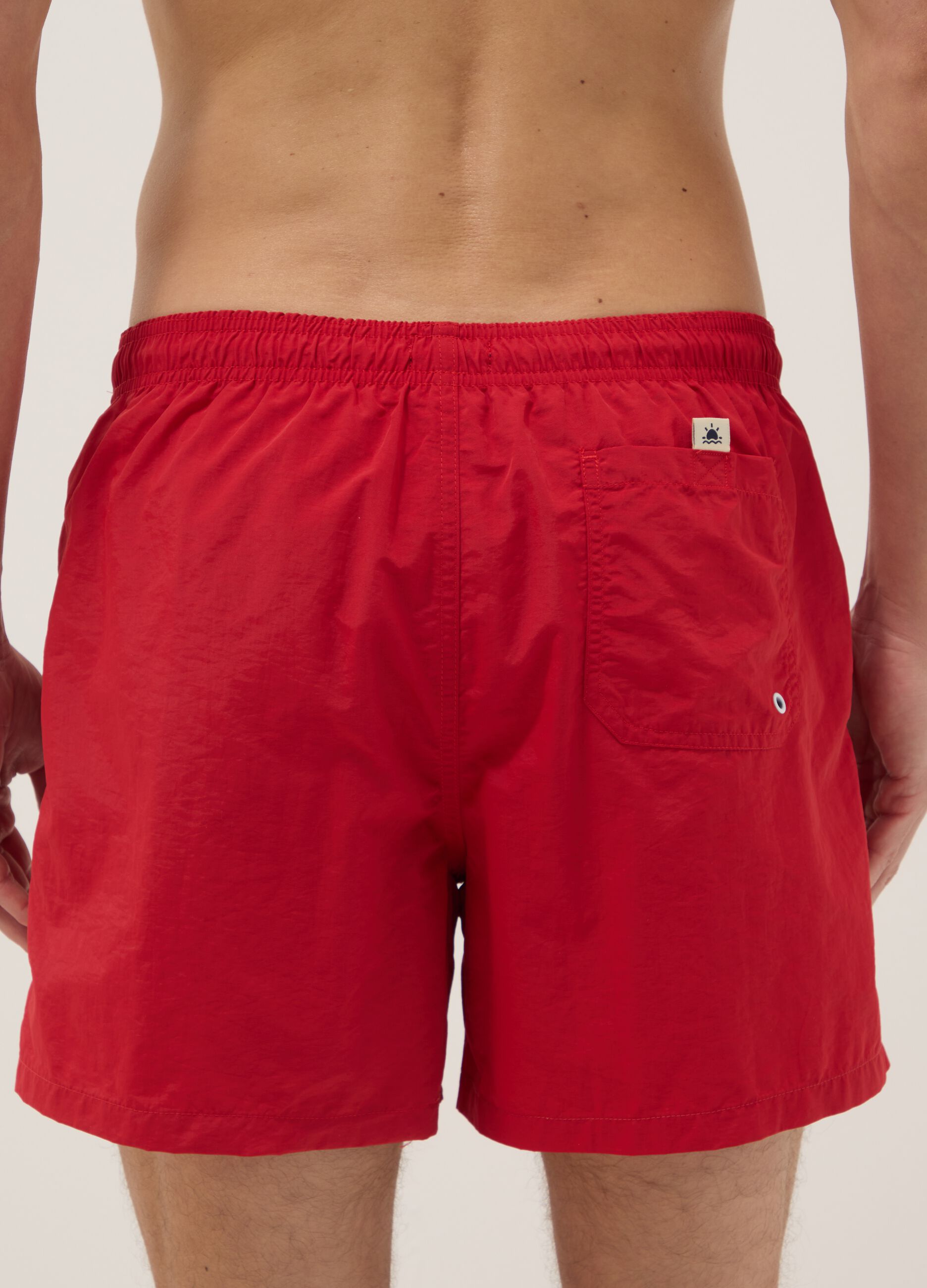 Red swim shorts with elasticated waist