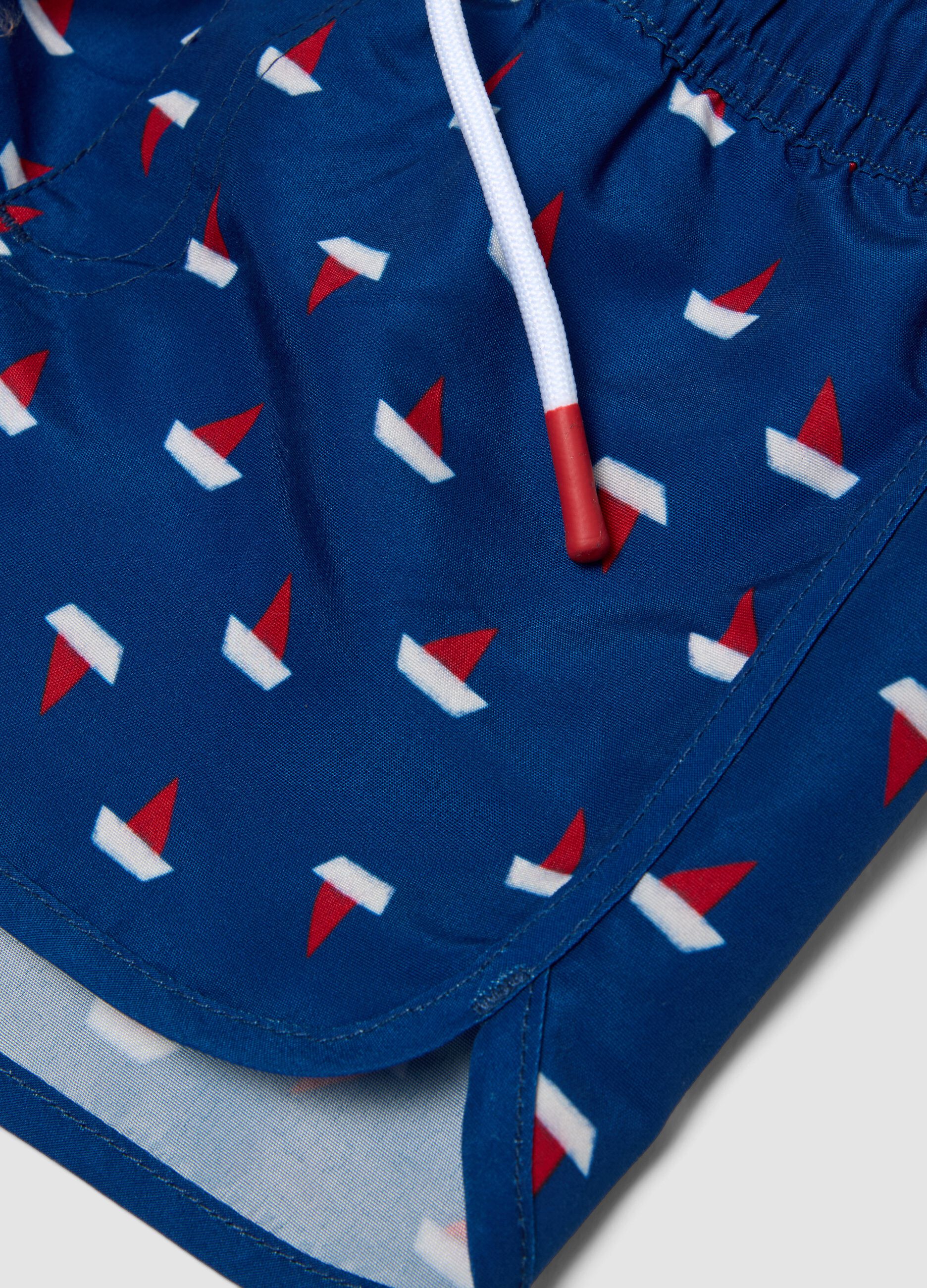 Boys&rsquo; blue boxer swim shorts with little boat print