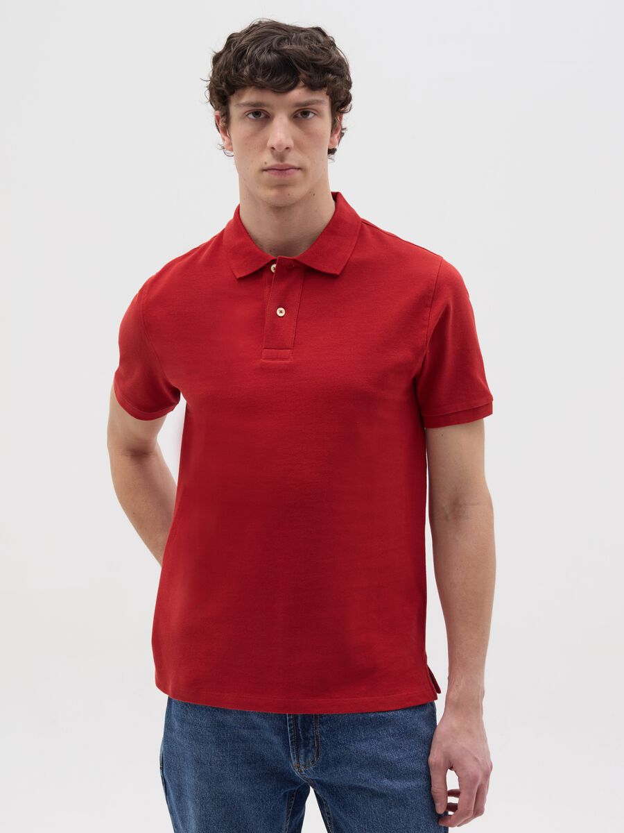 Solid colour polo shirt in organic cotton_0
