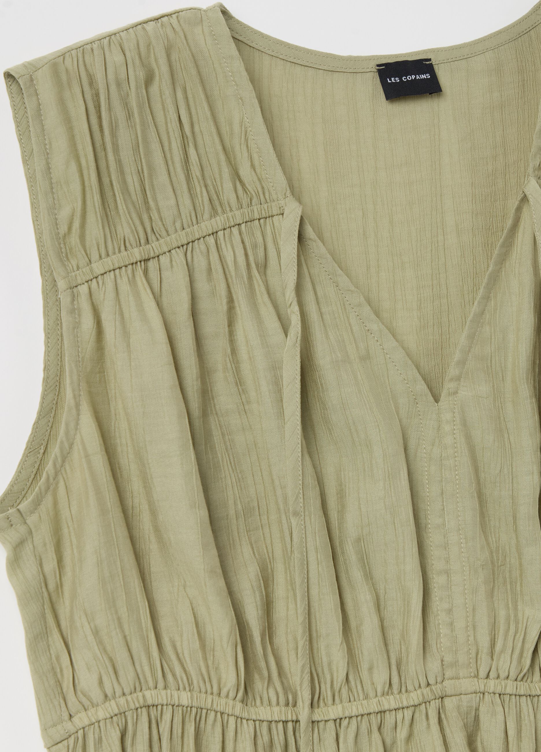 Blusa scollo a V con laccetto