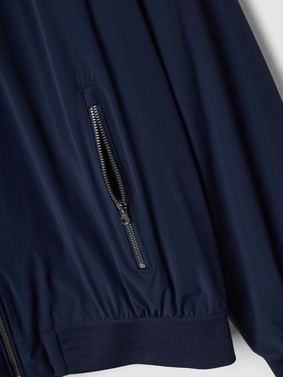 Giubbotto blu in tessuto elasticizzato con zip_1