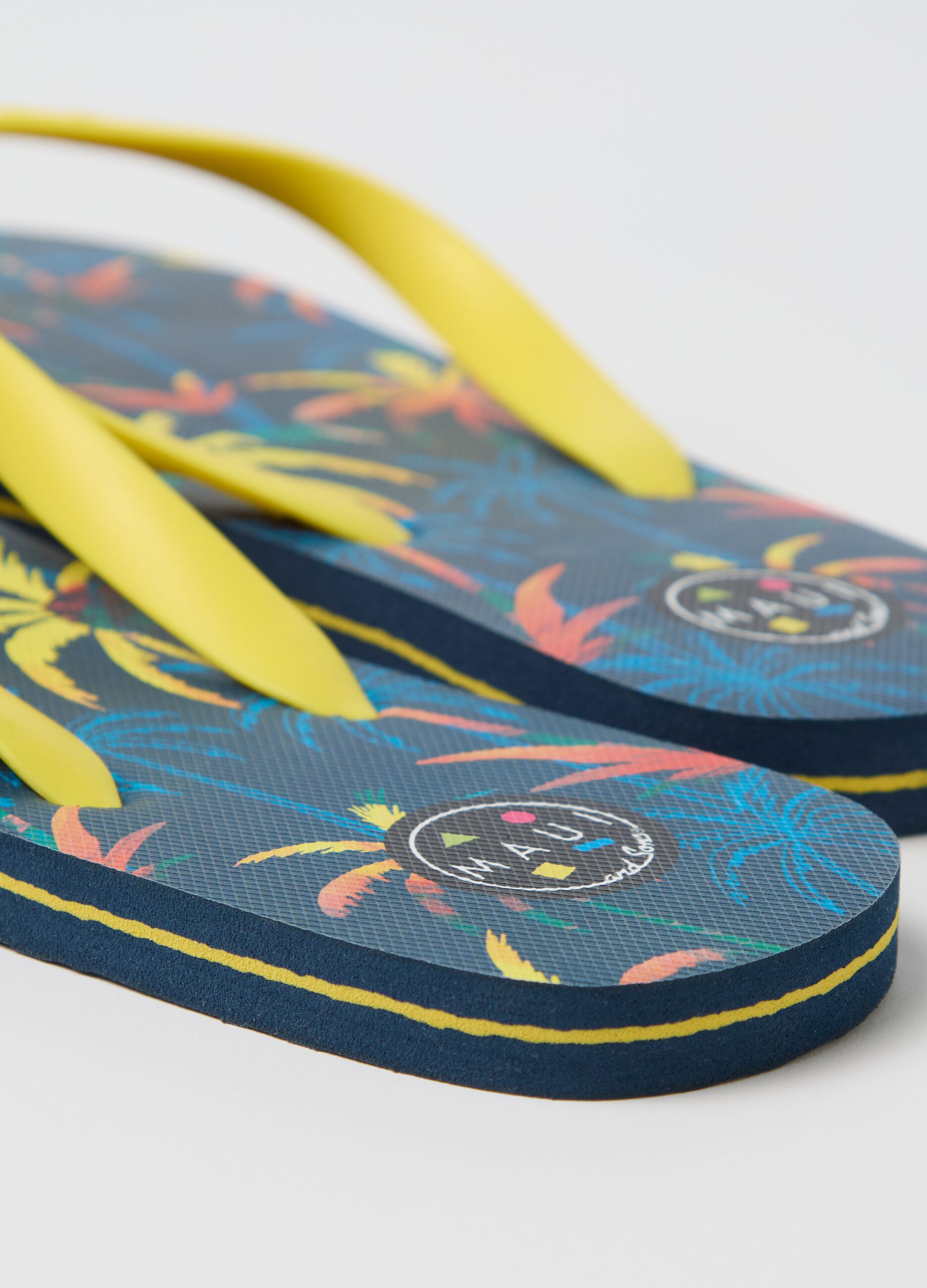 Maui and Sons blue flip flops with tropical print