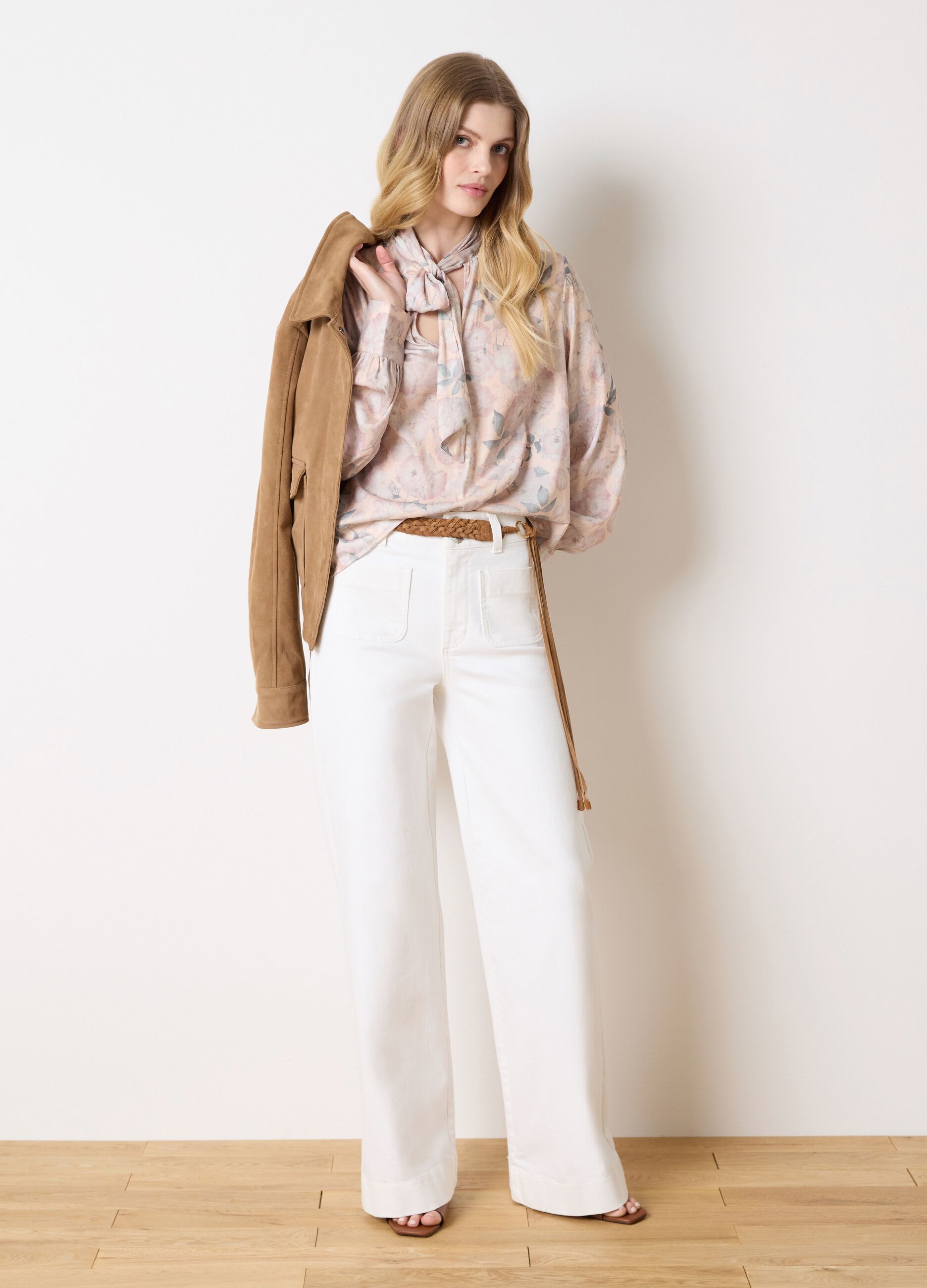 Beige blouse with floral pattern and bow
