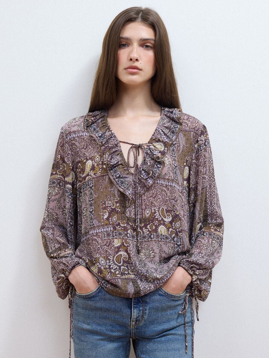 Purple patterned blouse with ruffles and tie neck_1