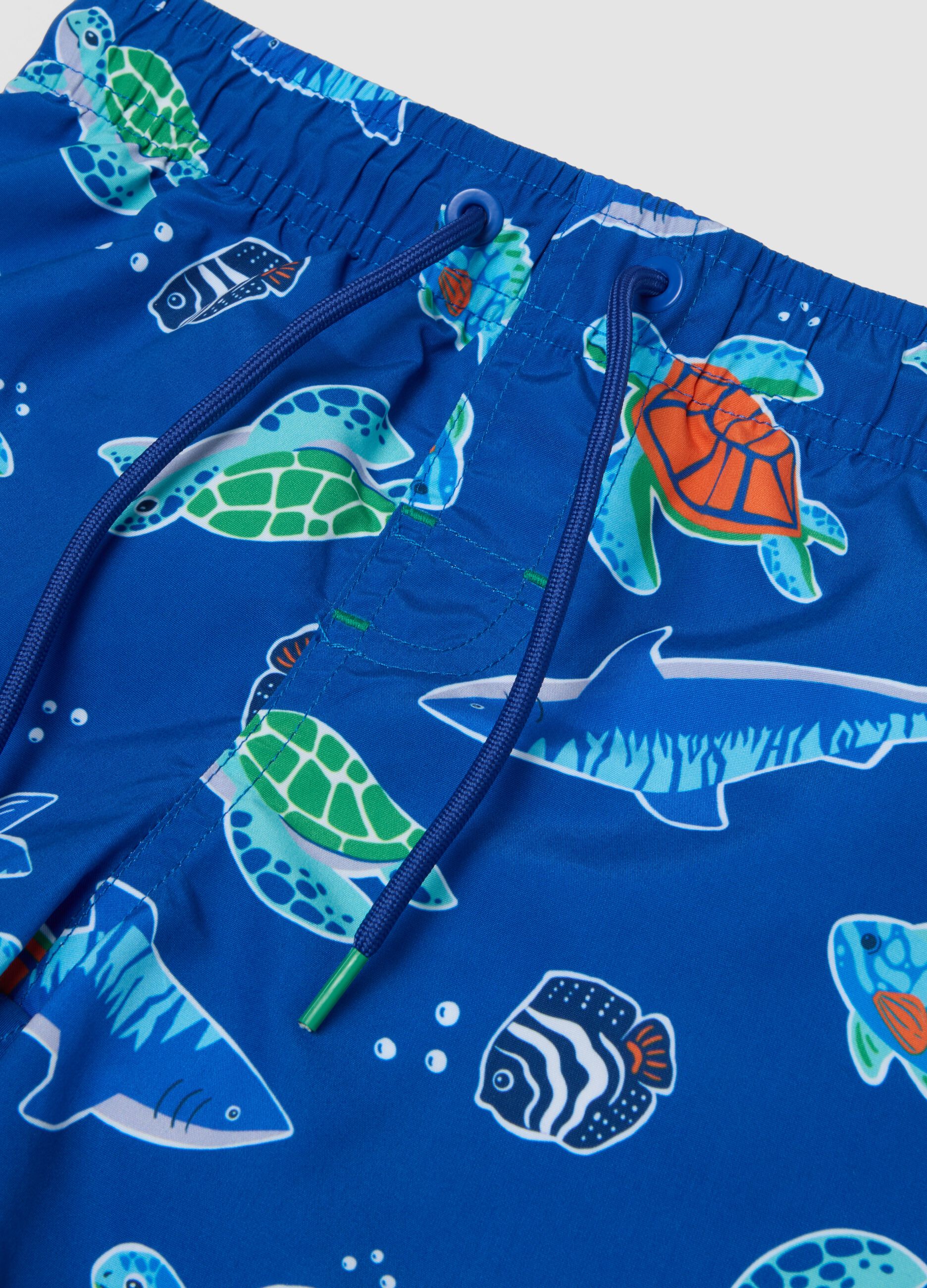 Blue boys&rsquo; swim shorts with ocean print