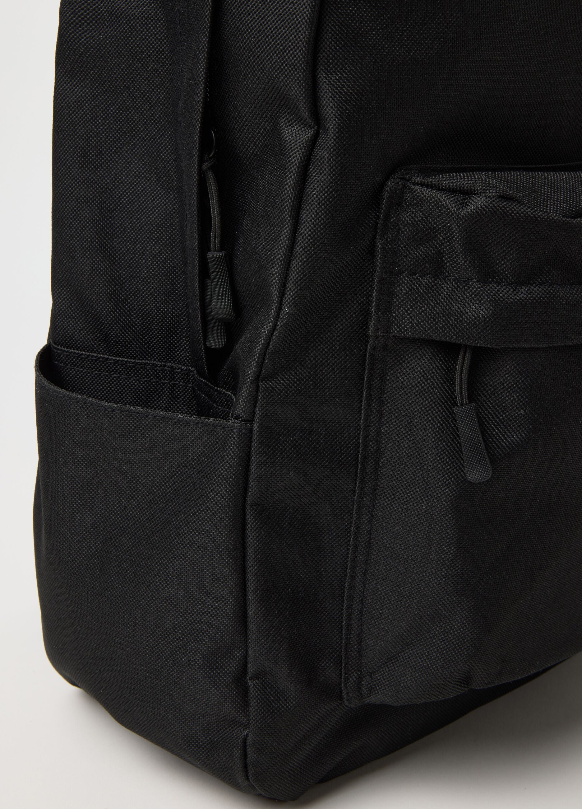 Black sports backpack with large pockets