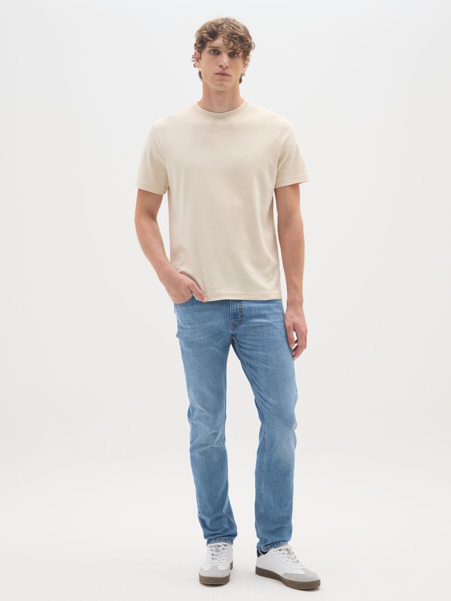 Jeans in denim blu in cotone elasticizzato slim fit_0