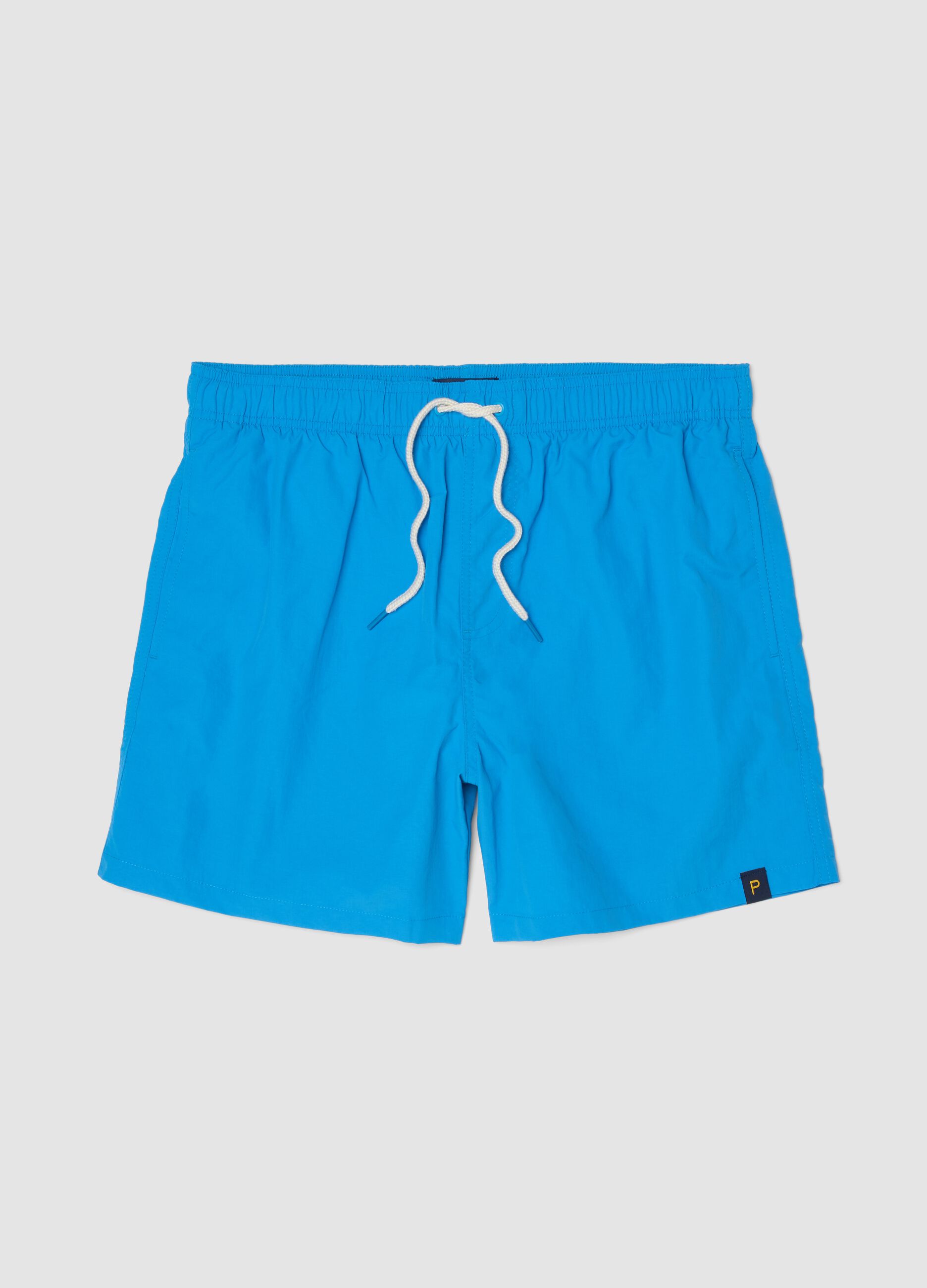 Blue swim shorts with elasticated waistband and contrast drawstring