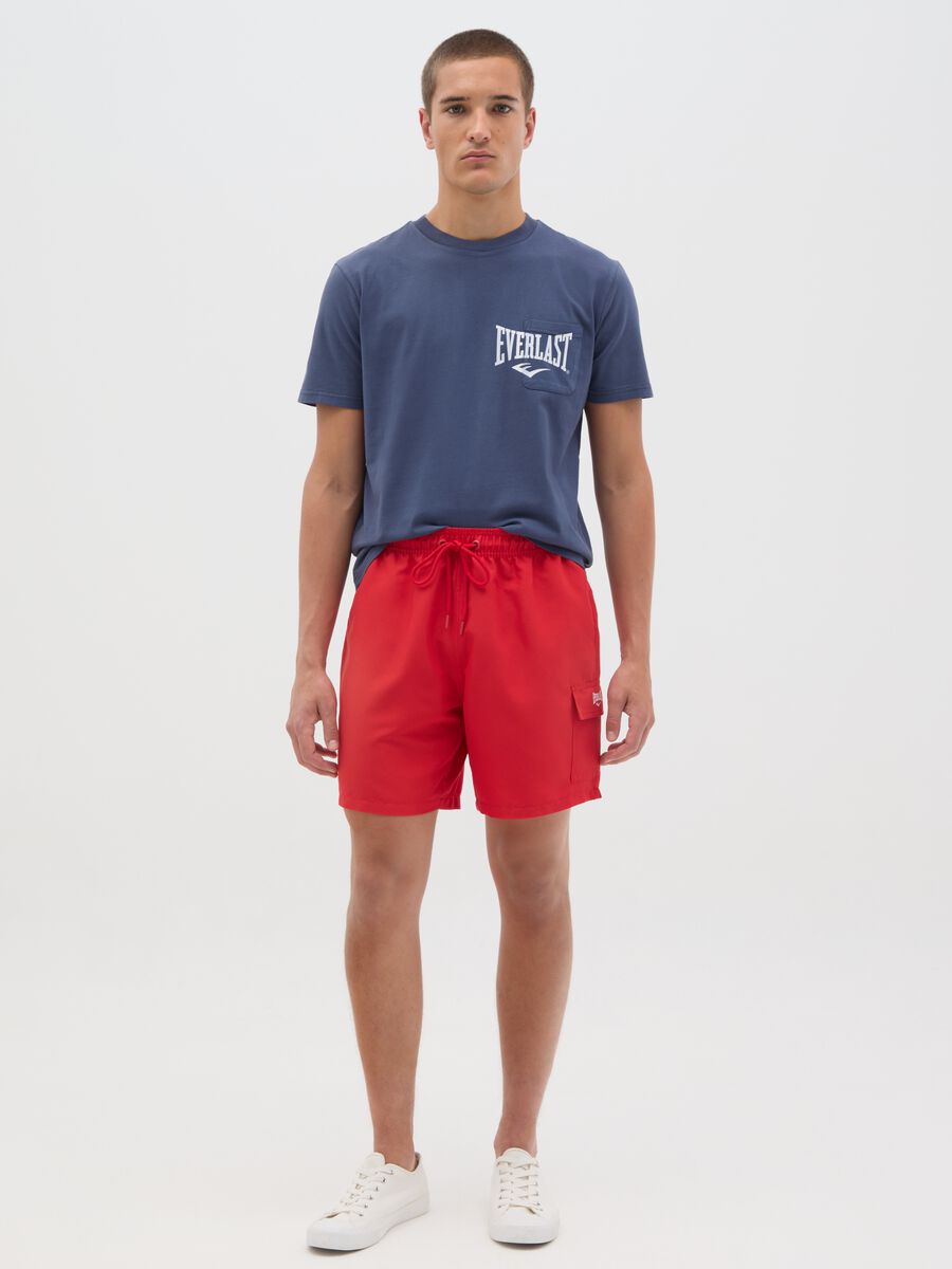 Red swimming trunks with logo print_0