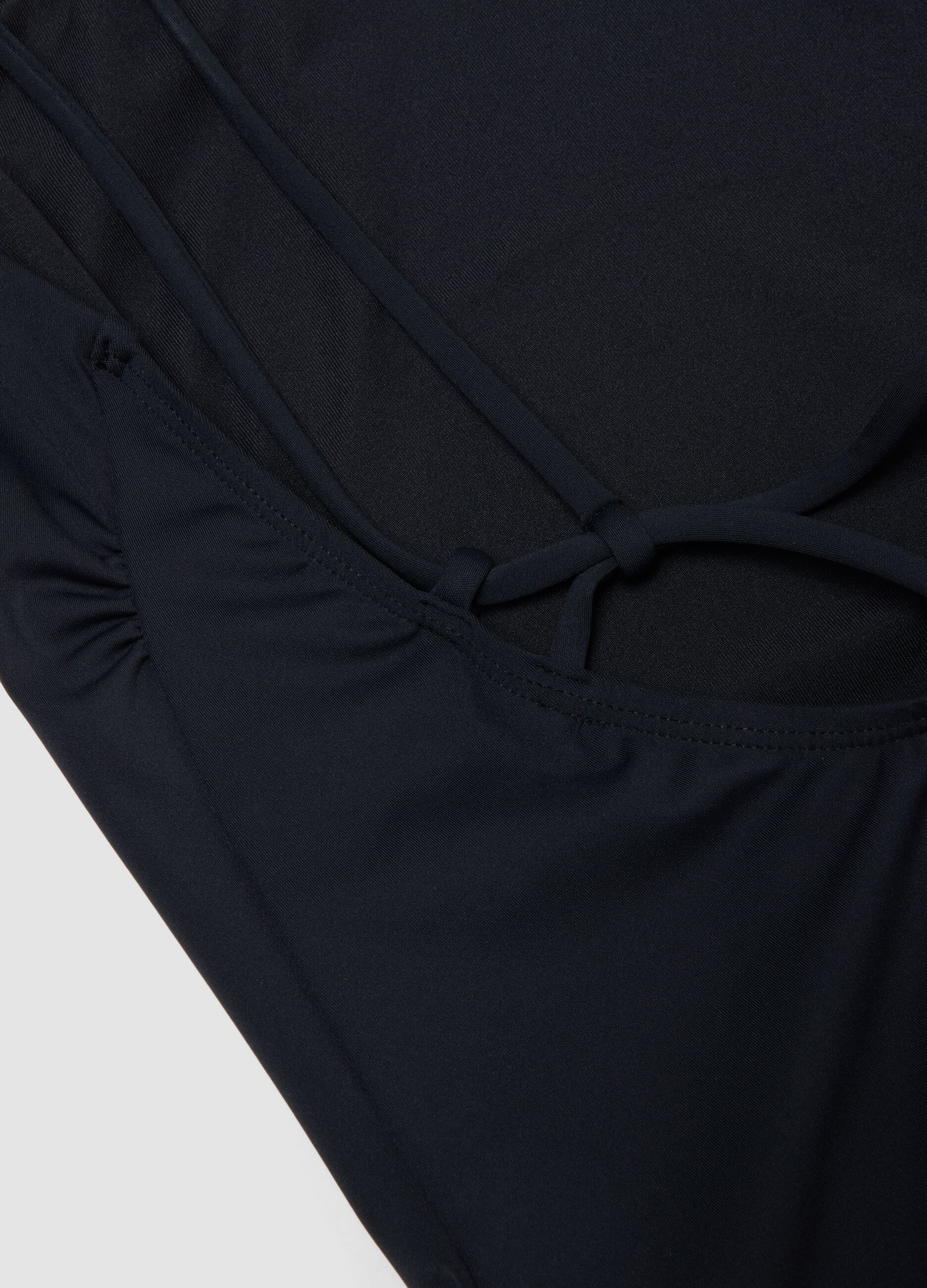 Black stretch-fabric swimsuit with thin straps