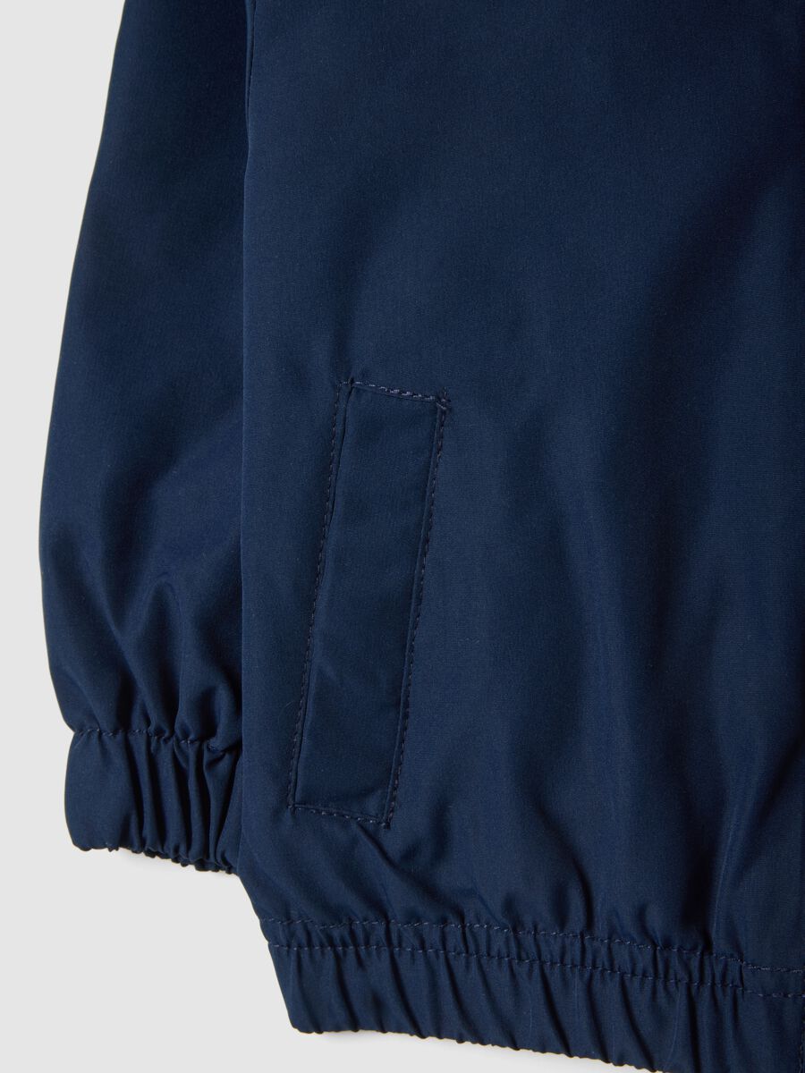 Blue waterproof children's jacket, regular fit with zip and hood_3