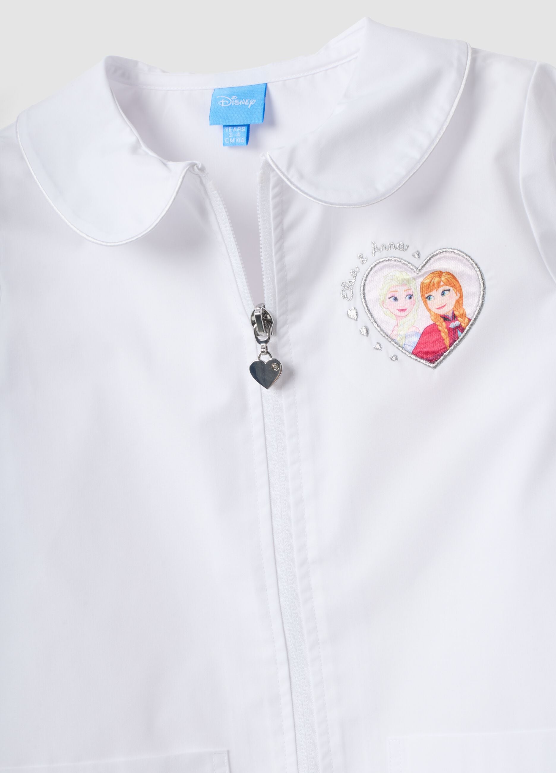 White nursery apron with Frozen embroidery