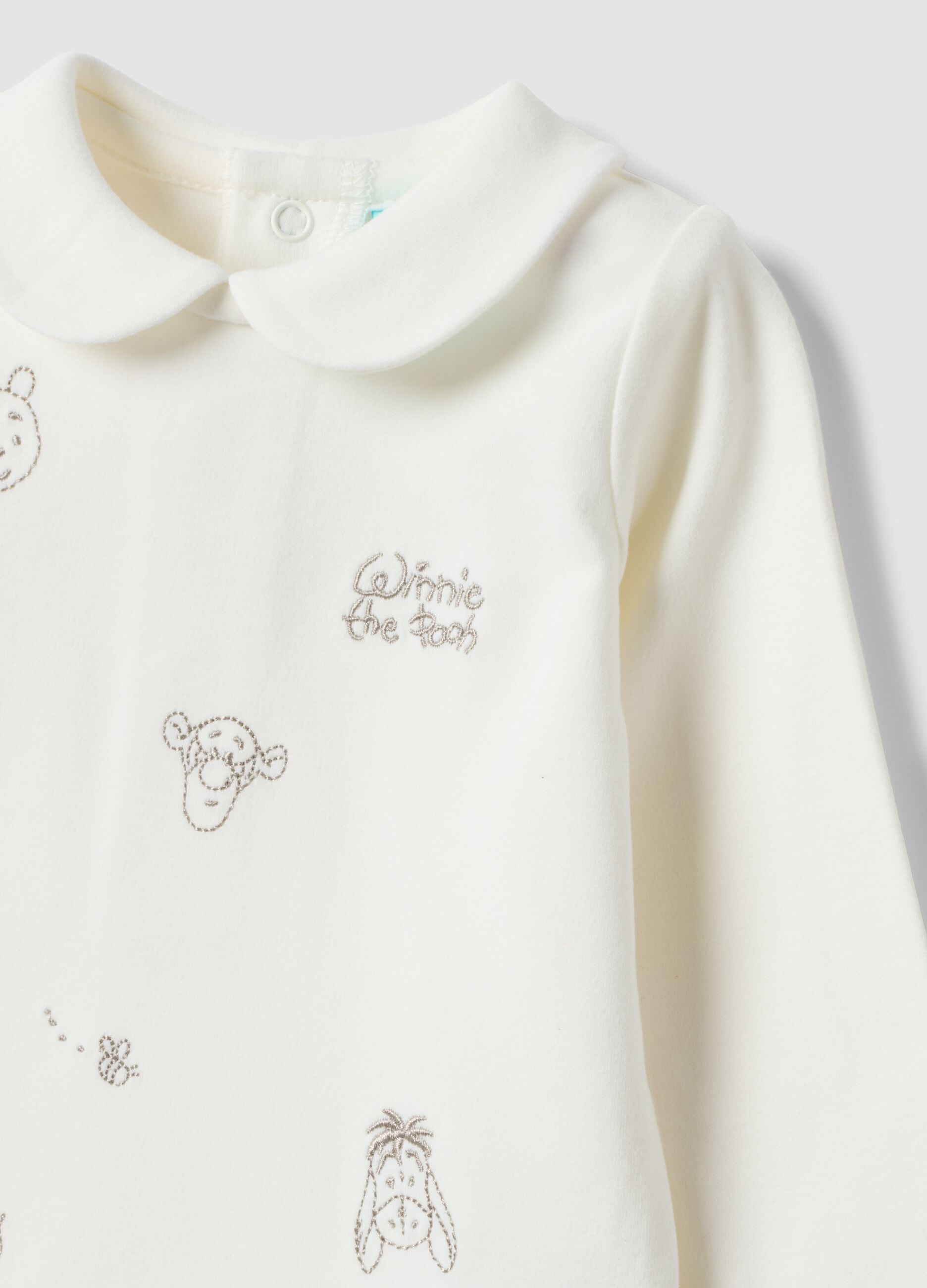 White organic cotton baby bodysuit with collar and Winnie the Pooh print